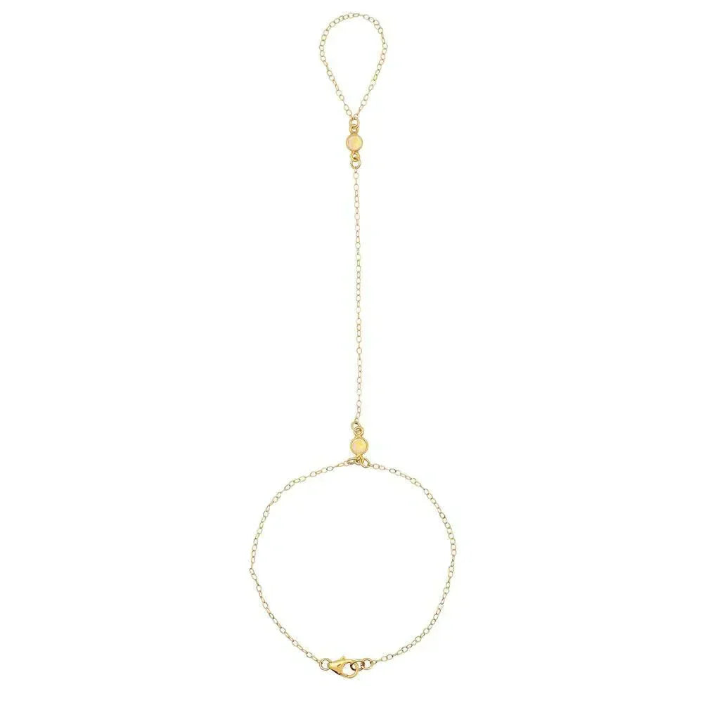 Gold-toned hand chain accessory worn by Scheana Shay in Vanderpump Rules article