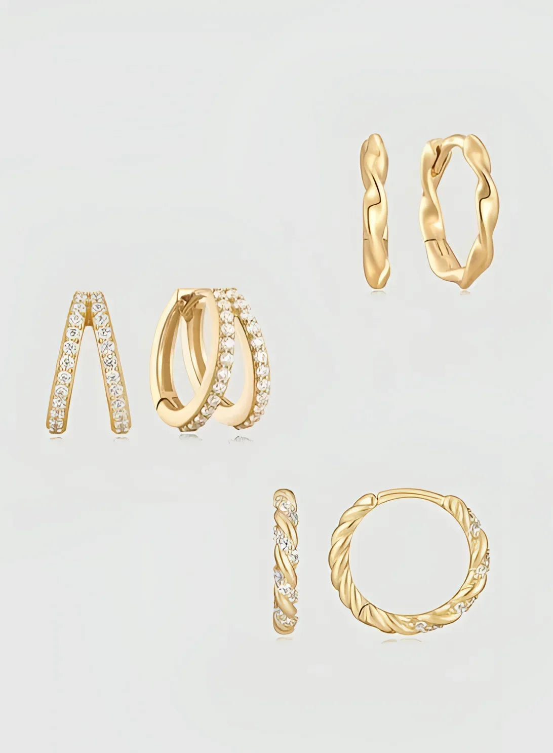 Gold-toned earrings from 14K Gold & Diamond Twisted Huggie Hoops product shot