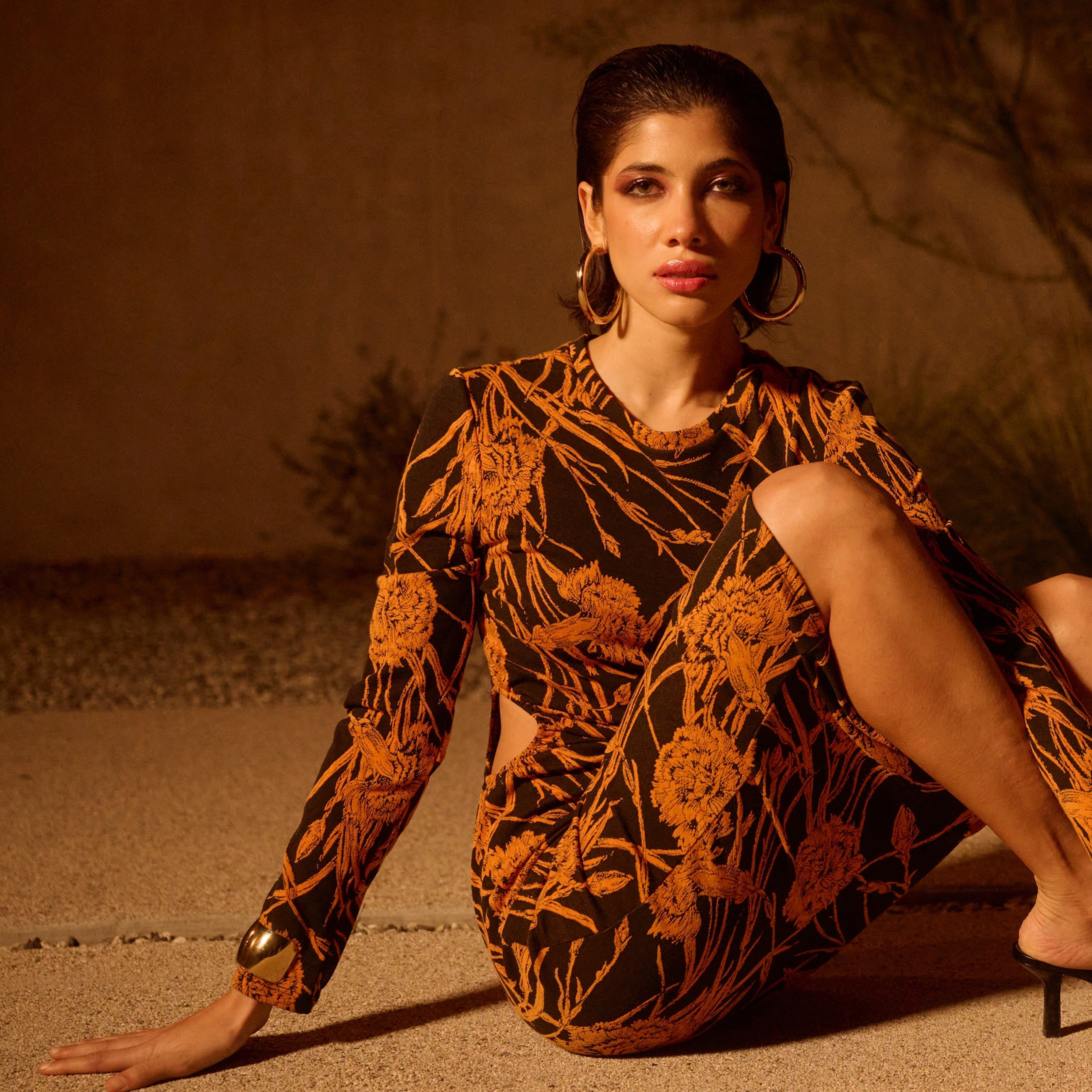 Floral-patterned long-sleeved dress paired with 2.5 inch Ryan Hoops jewelry