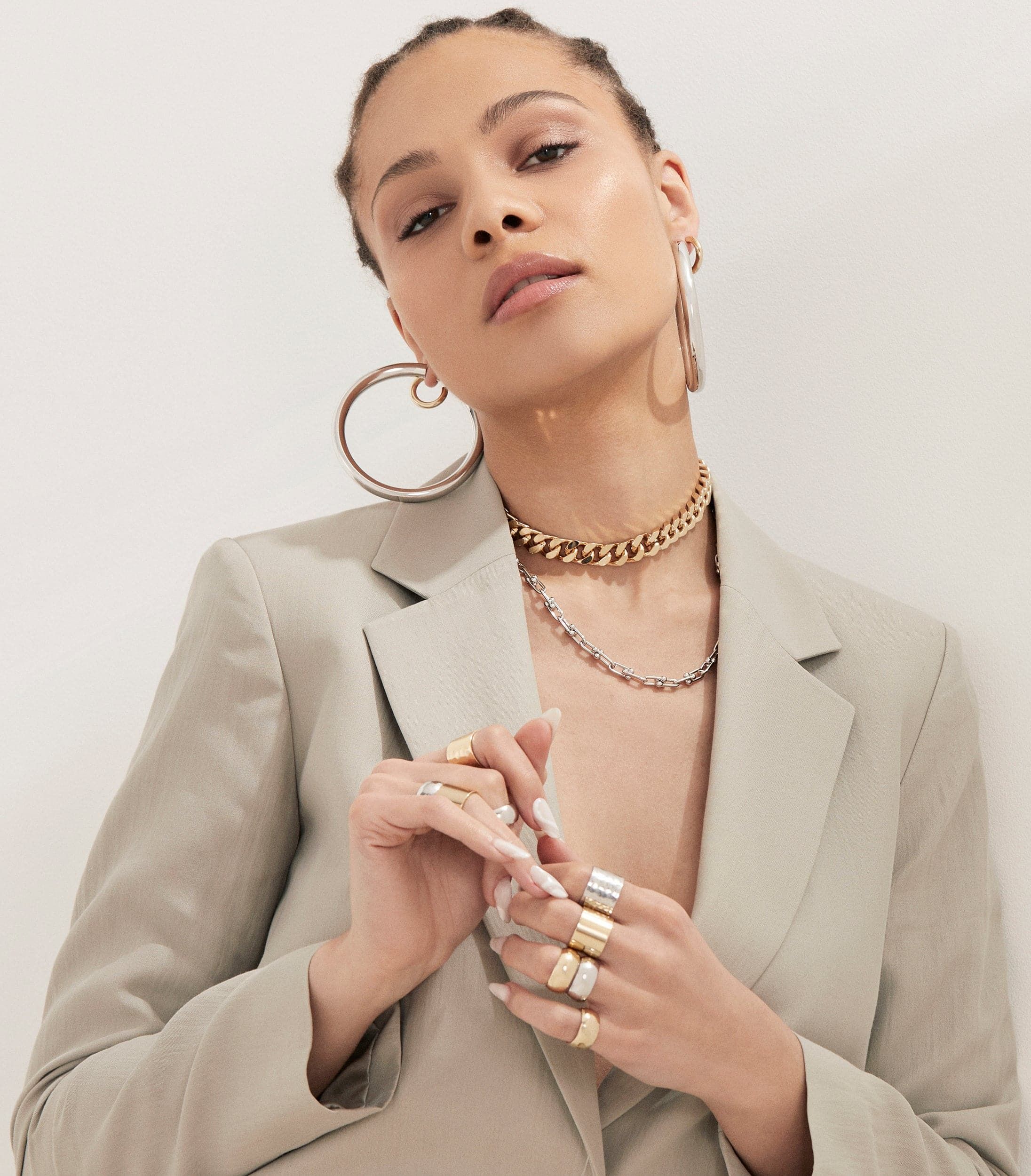 Woman in a blazer showing off 2.5 inch Ryan Hoops jewelry earrings