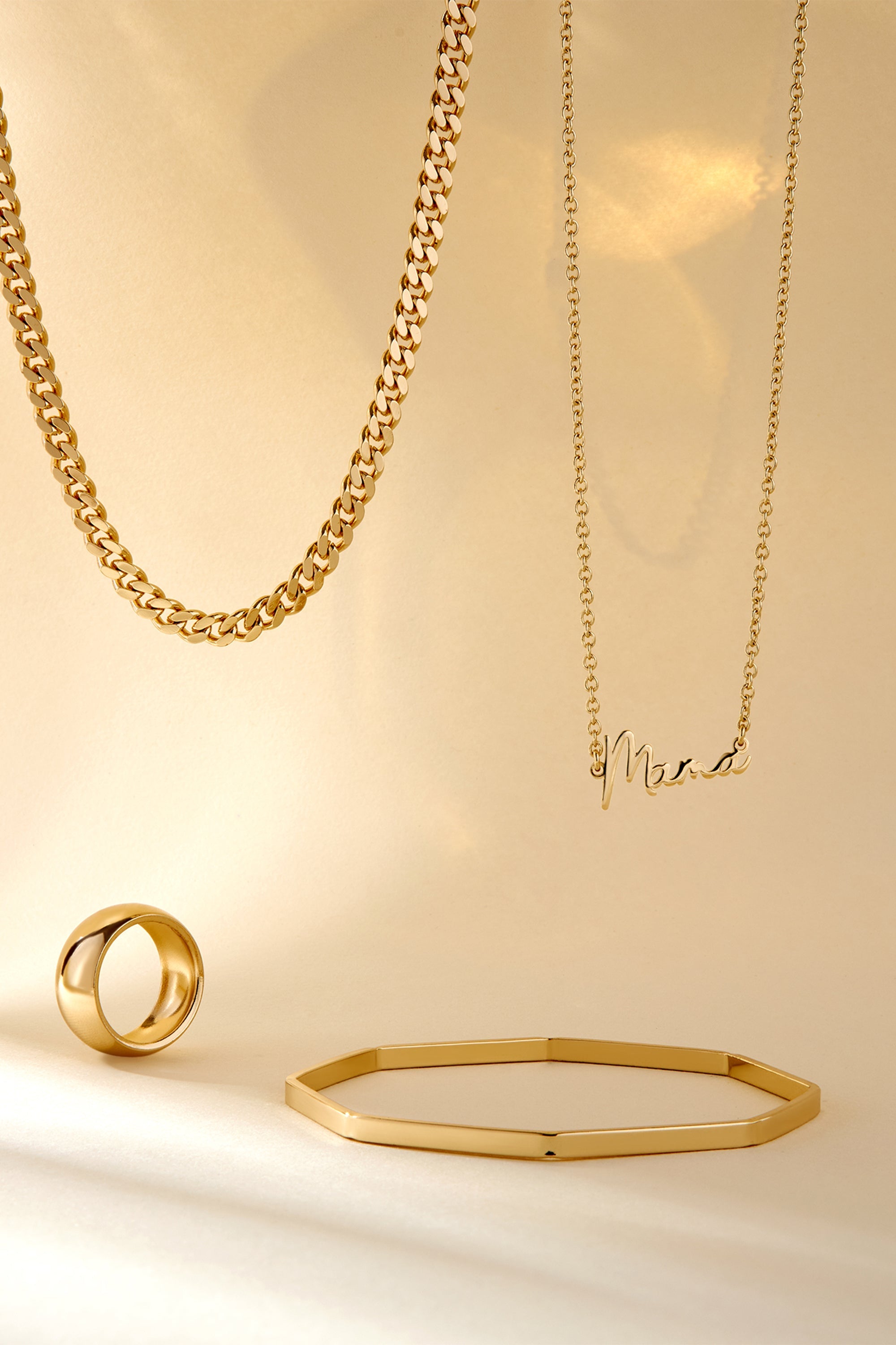 Gold jewelry collection featuring a stylish 9.5mm Domed Ring