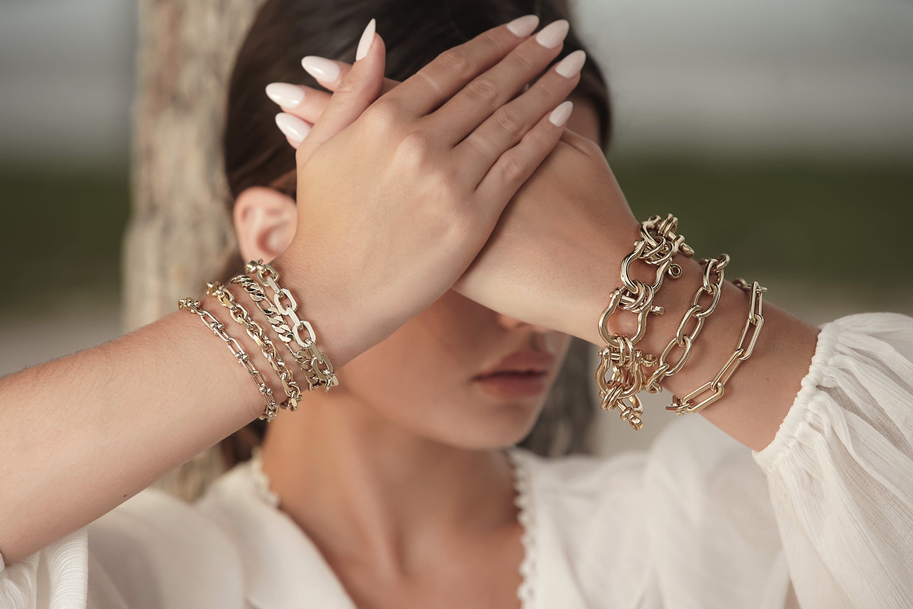 Gold chain bracelets from the Lennon Bracelet collection adding style to your look