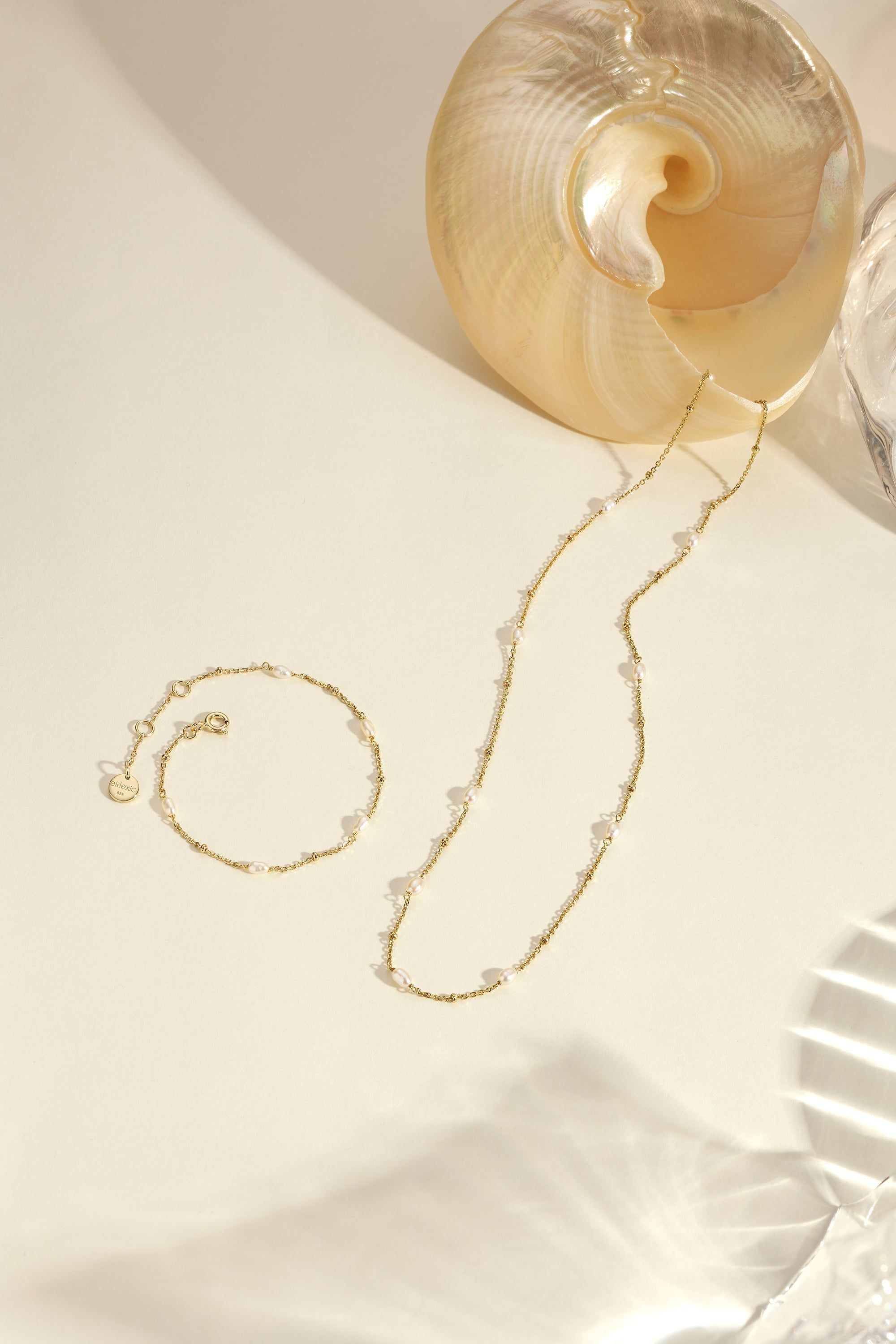 Gold necklace and bracelet with pearl accents from Micro Alternating Pearl Bead Bracelet