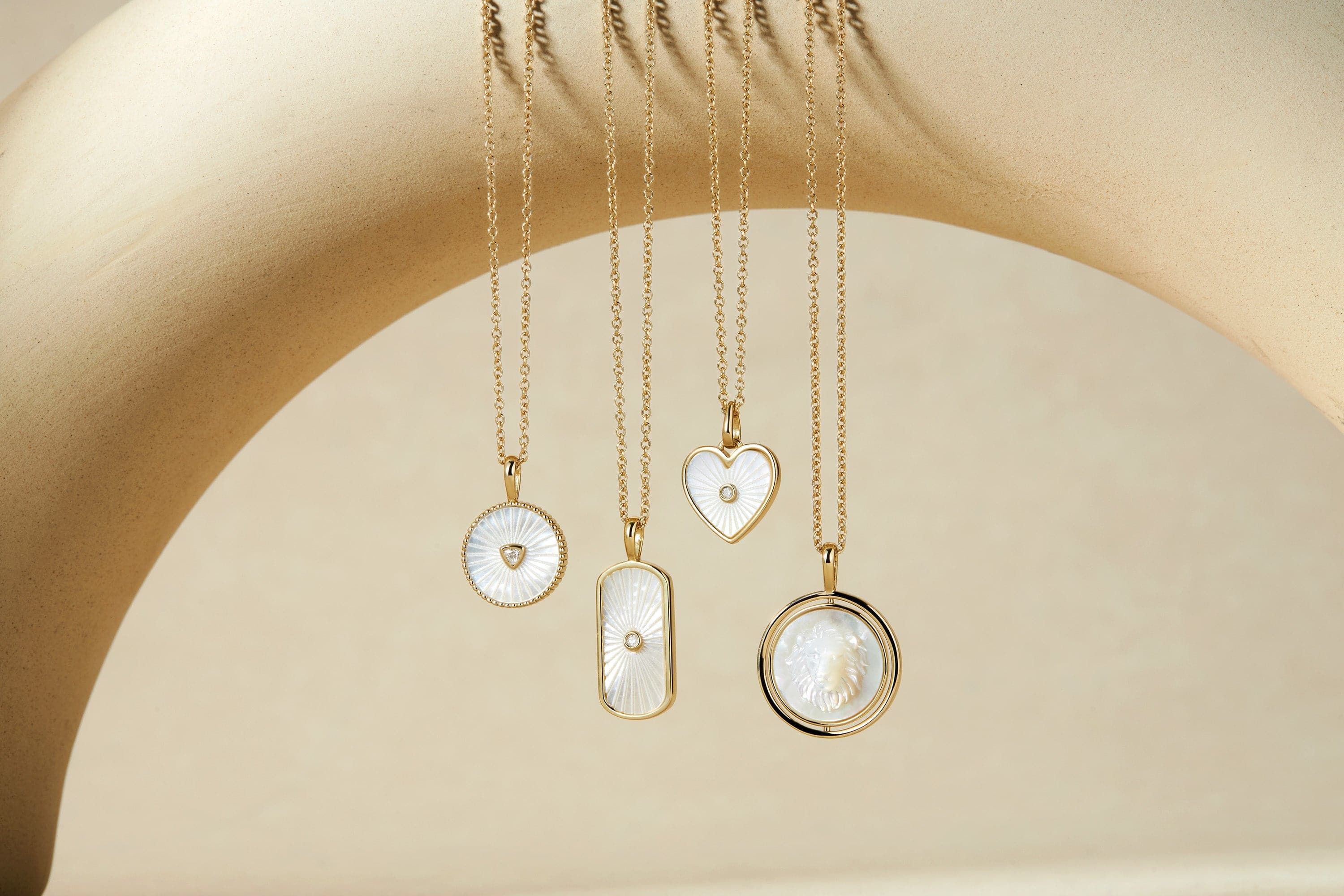 Gold necklaces with beautiful mother of pearl lion pendants good for everyday style