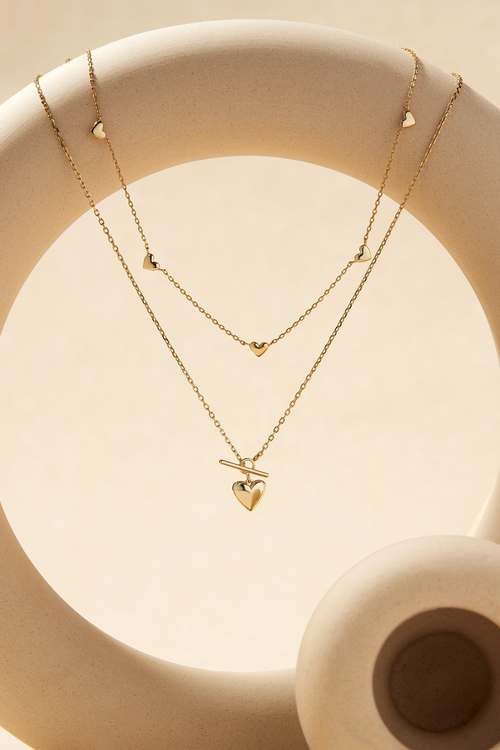 Gold heart pendant layered necklace from the Multi Micro Heart Necklace collection