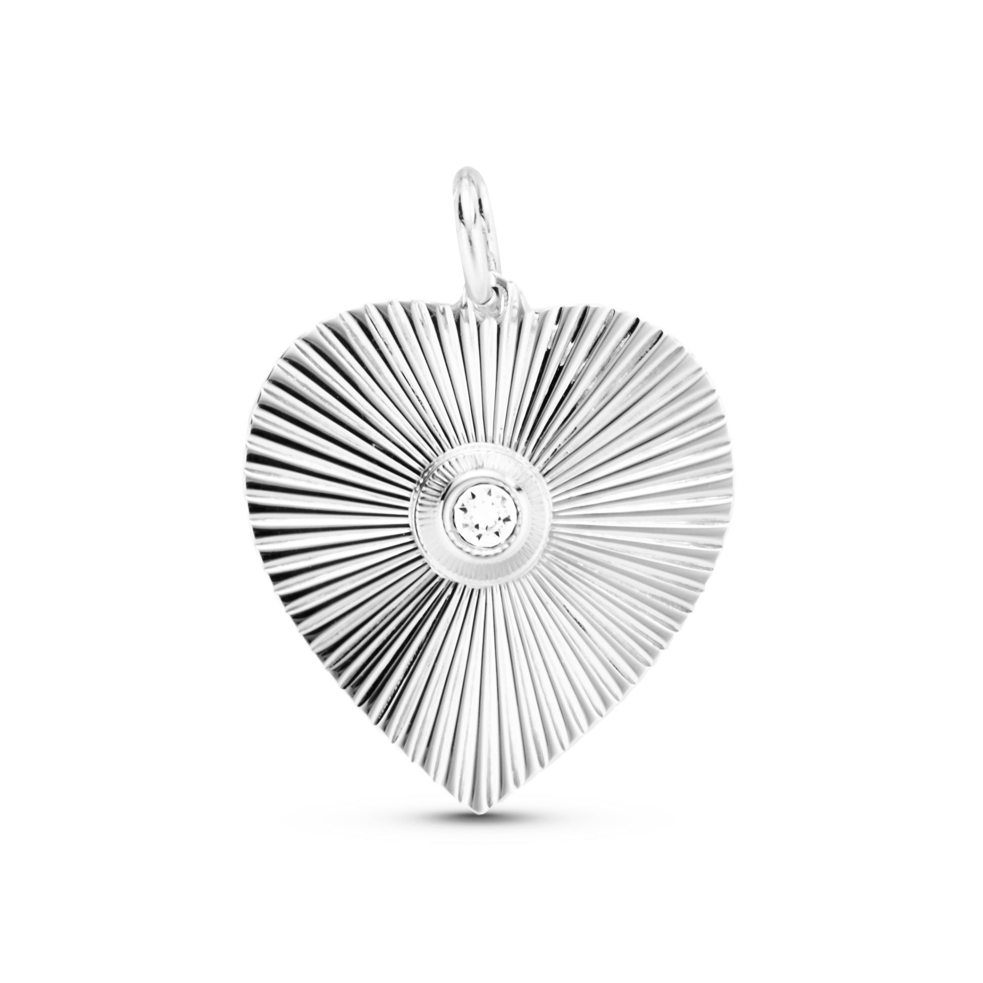 Silver heart pendant with a sparkling central gemstone from Perla Heart Pendant collection