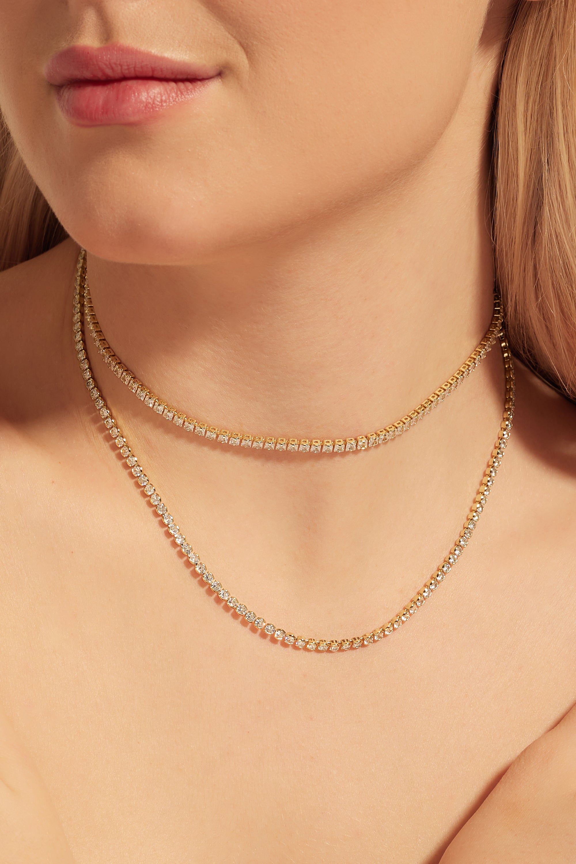 Gold and diamond tennis necklaces on display for the Round CZ Tennis Necklace product