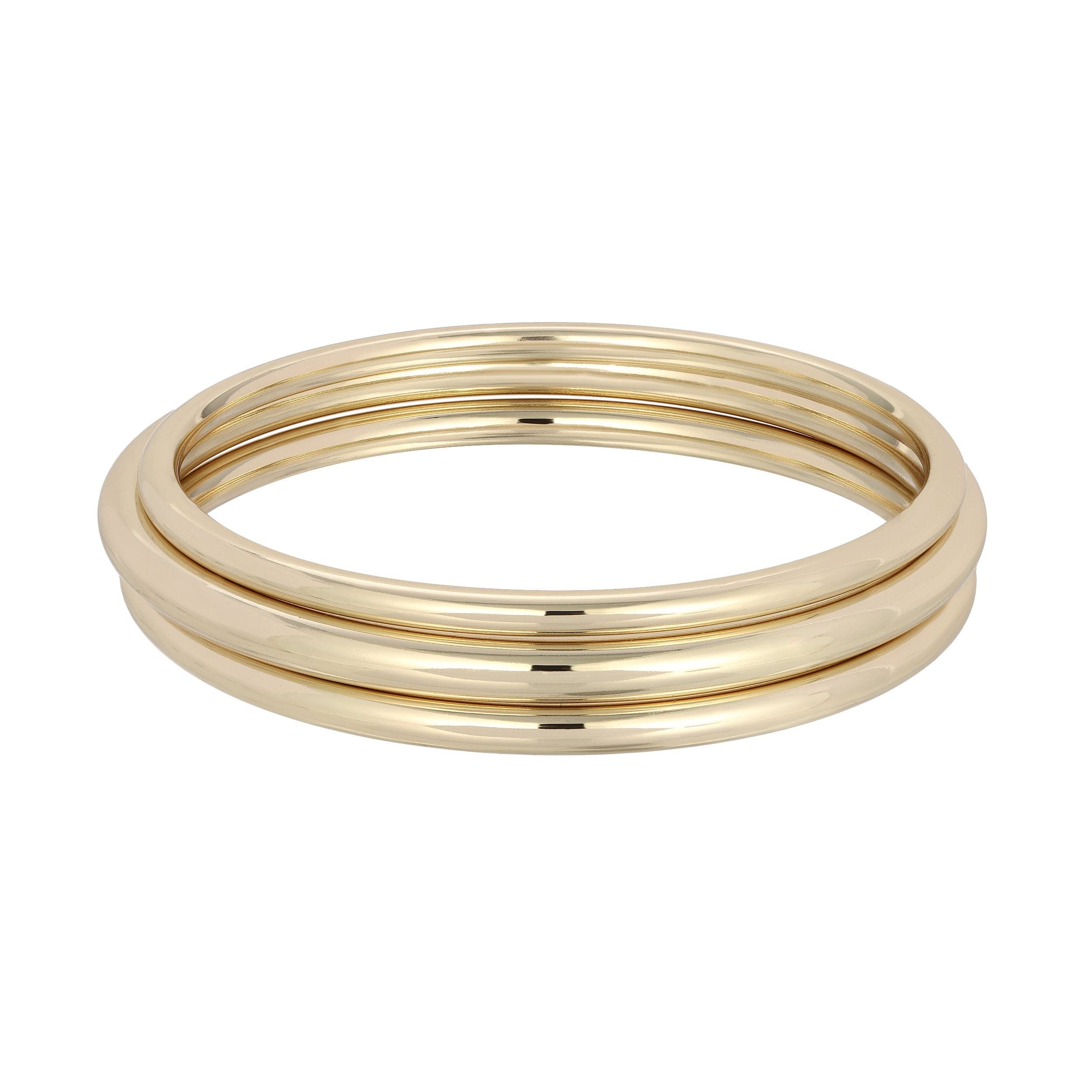 Three shiny gold bangles from the Round Classic Bangle collection for a chic look