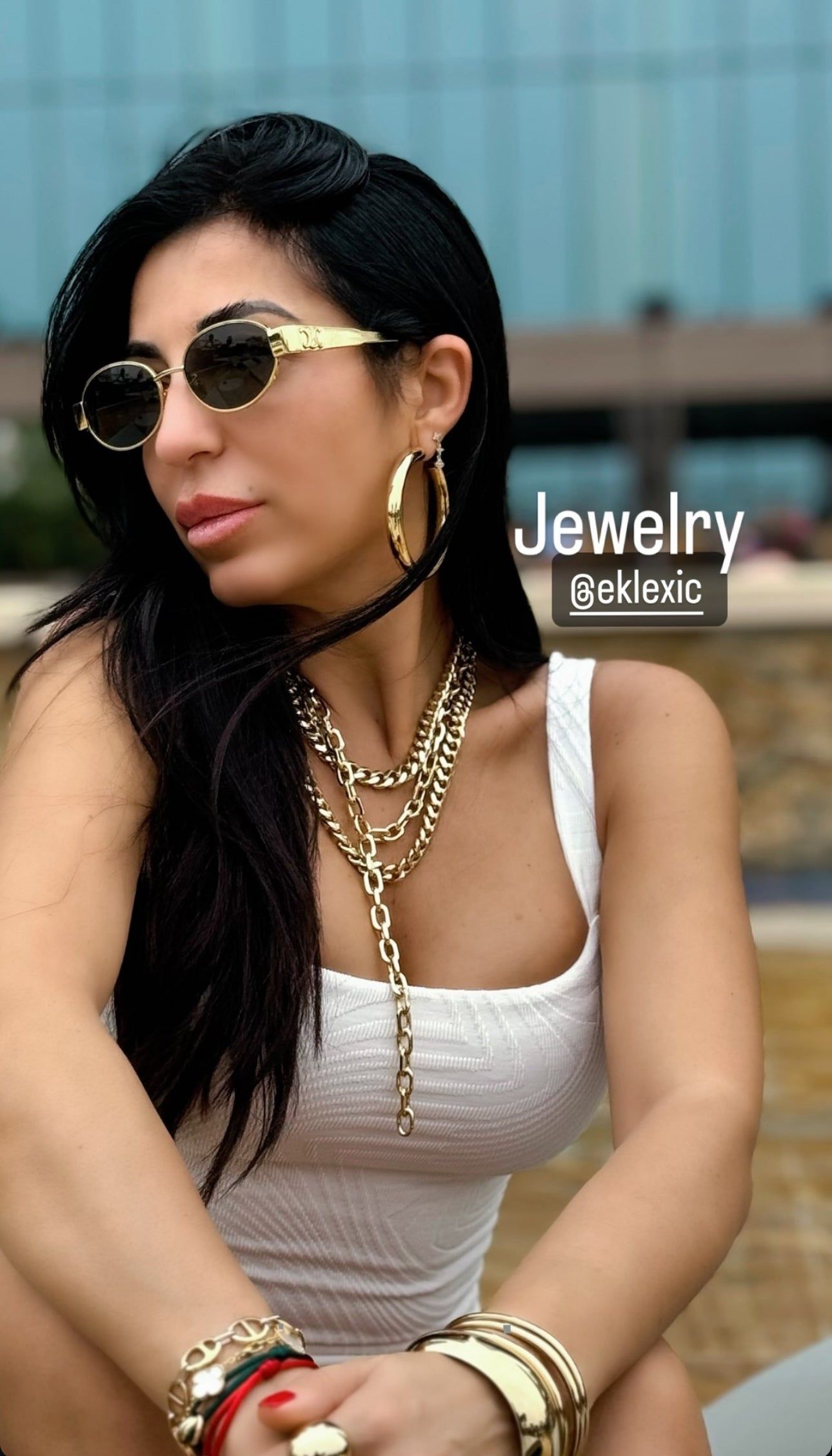 Woman wearing the elegant Serenity Necklace with stunning gold jewelry for a chic look