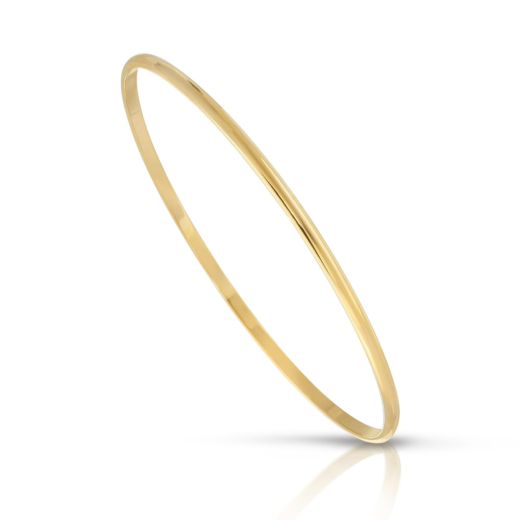 Slim and shiny gold bangle from the Skinny Lucy Bangle collection