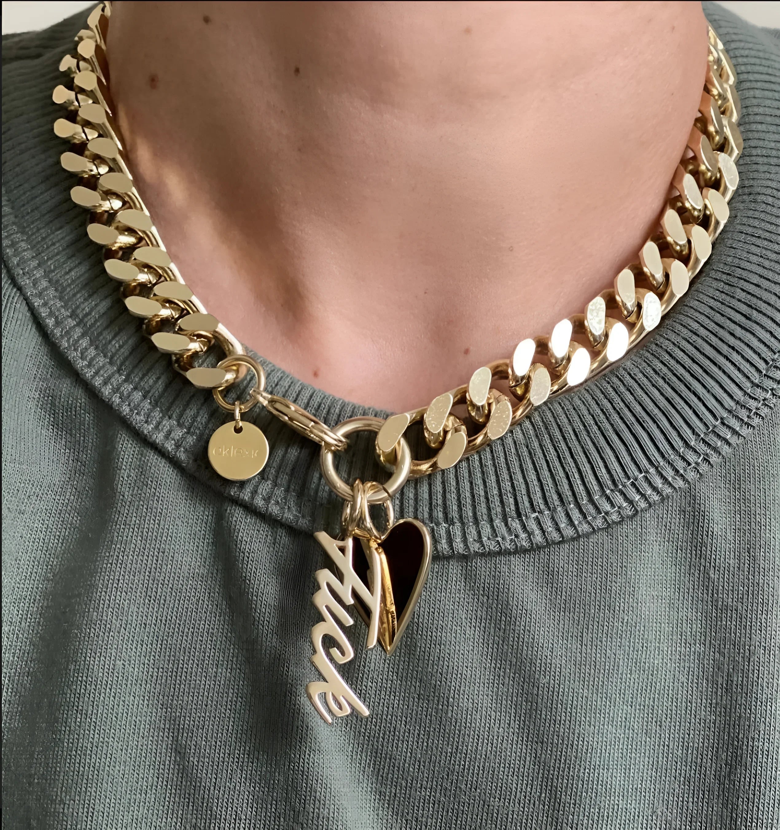 Gold chain necklace with heart and F*** charms from Taraji Necklace collection