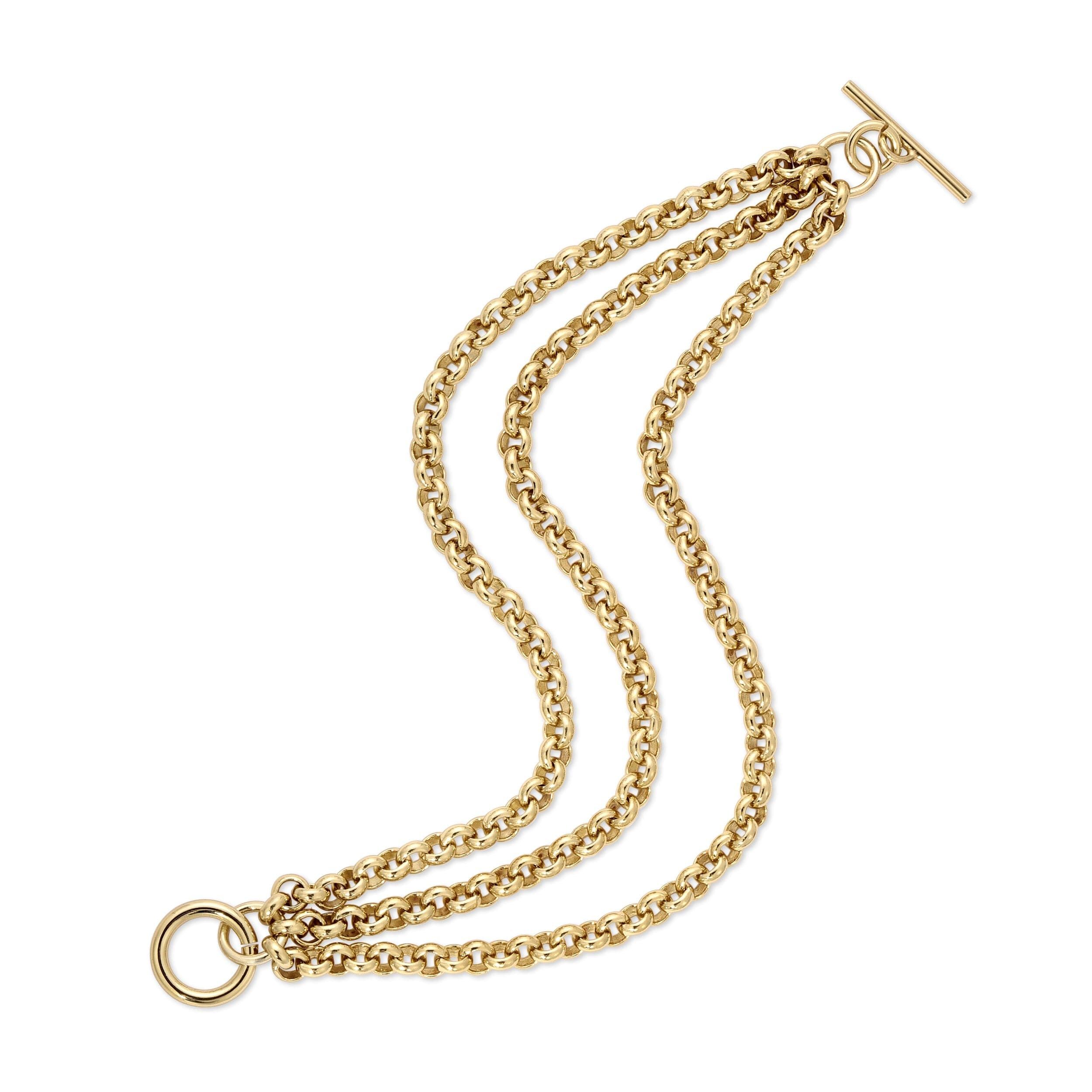 Gold triple-strand chain with toggle clasp on the Triple Micro Royal Chain Toggle Bracelet