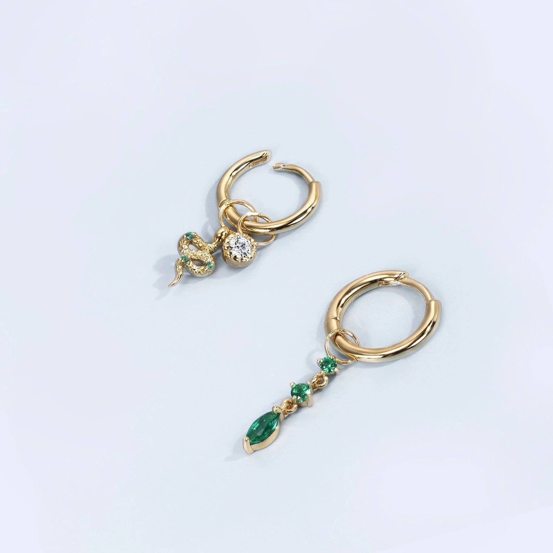 Demi-fine collection earrings featuring sterling silver snake hoop charm with gemstone charms