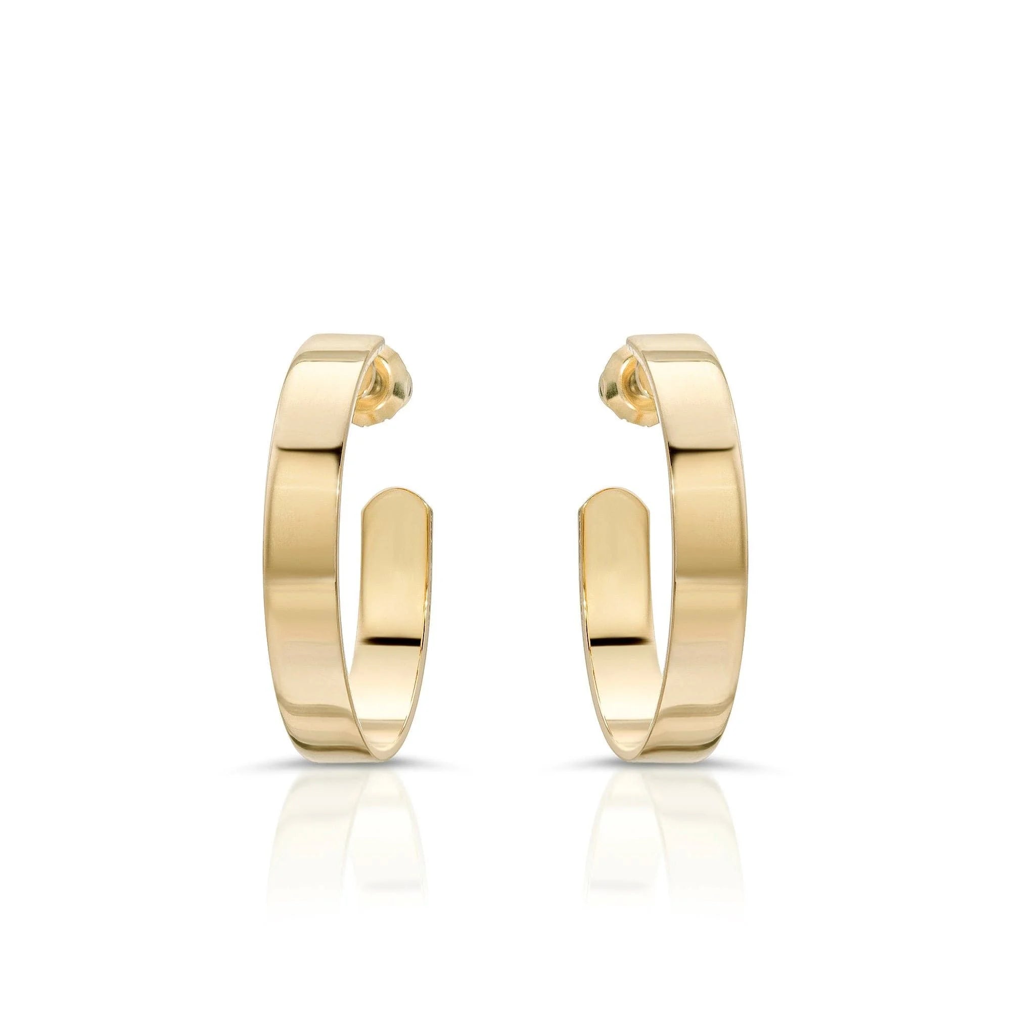 Shiny gold 1 inch Isla Hoops earrings showing off a cute and trendy style