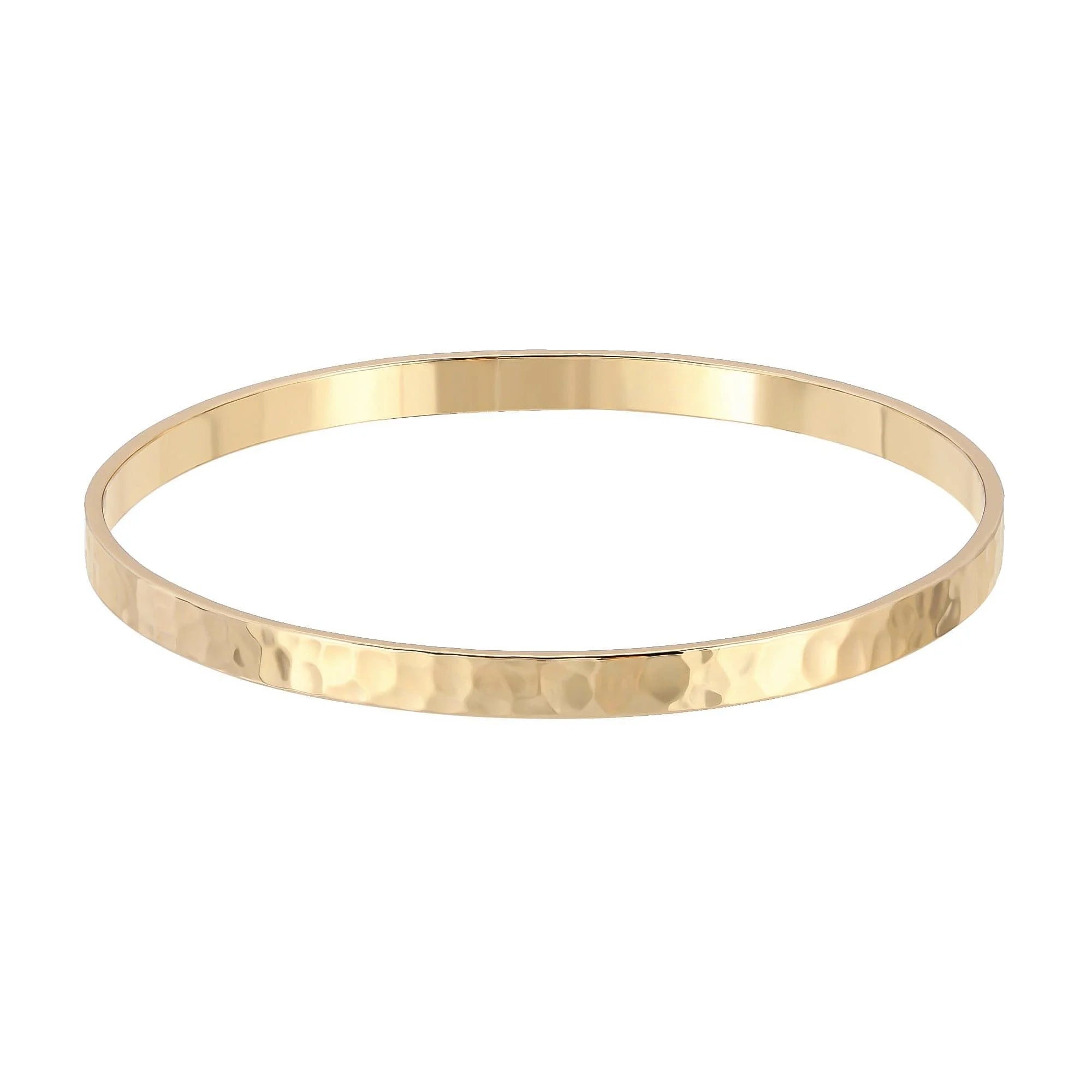 Gold hammered bangle looking shiny and stylish for a trendy jewelry piece
