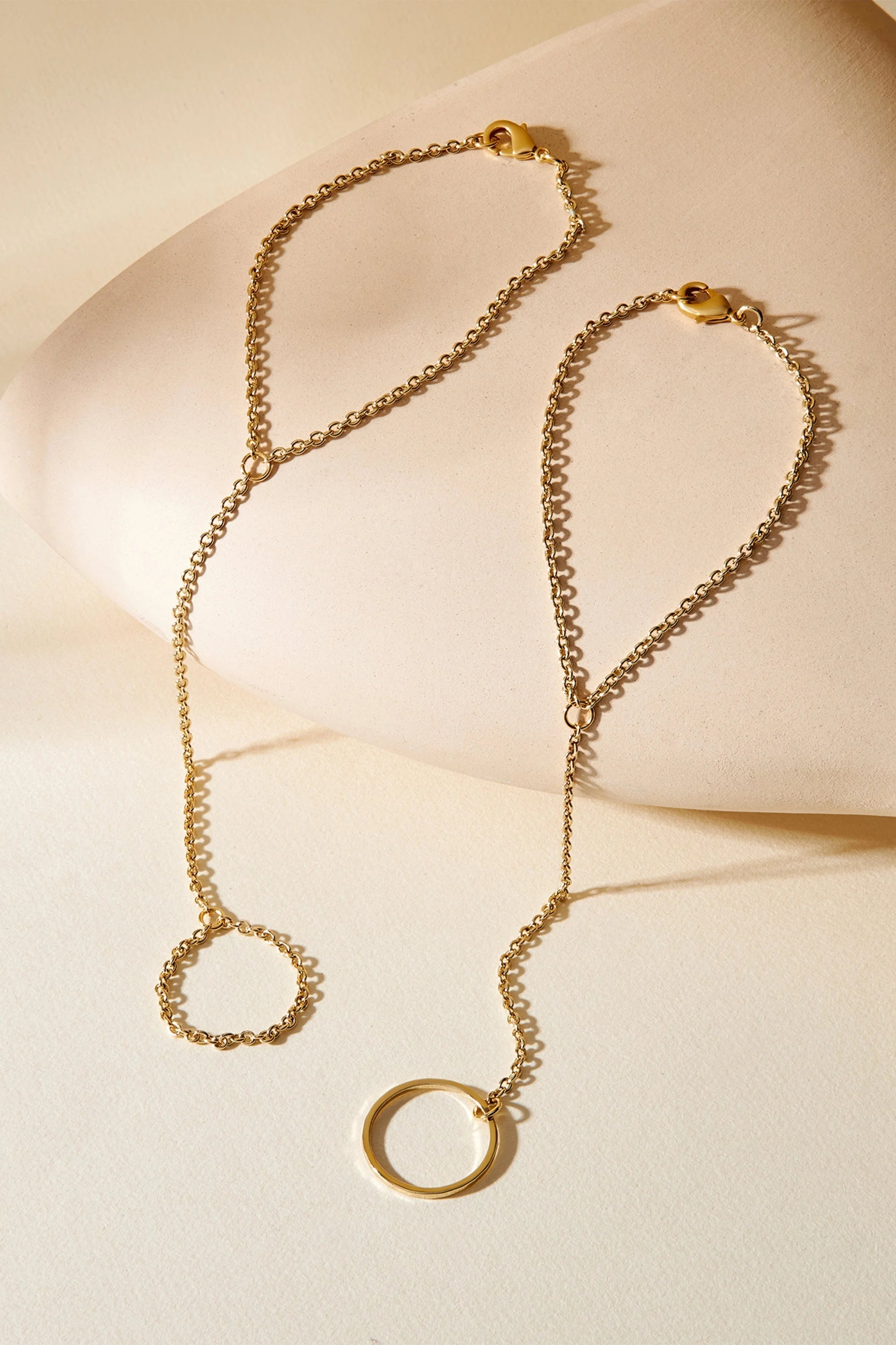 Two gold hand chain bracelets from Law Hand Chain for a stylish look