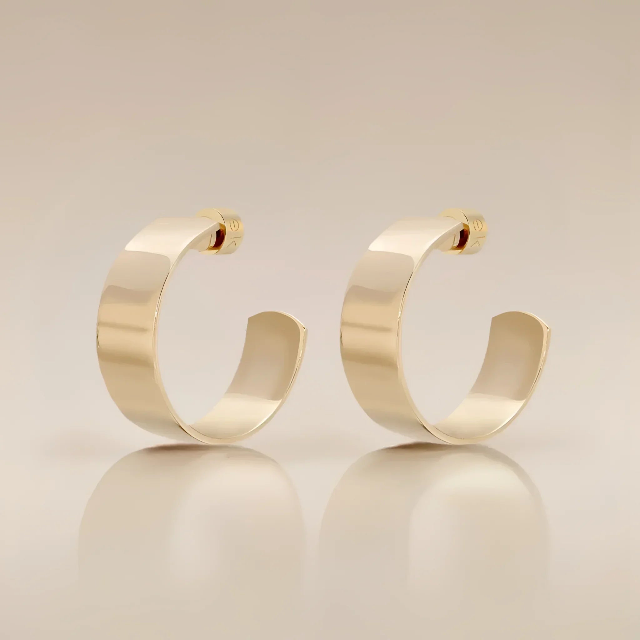 Pair of gold hoop earrings from the 1 Skylar Hoops collection