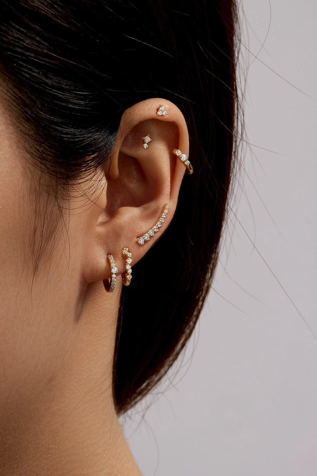 Sparkling earrings on ear with Graduated CZ Bar Ear Crawl jewelry perfect for style fans