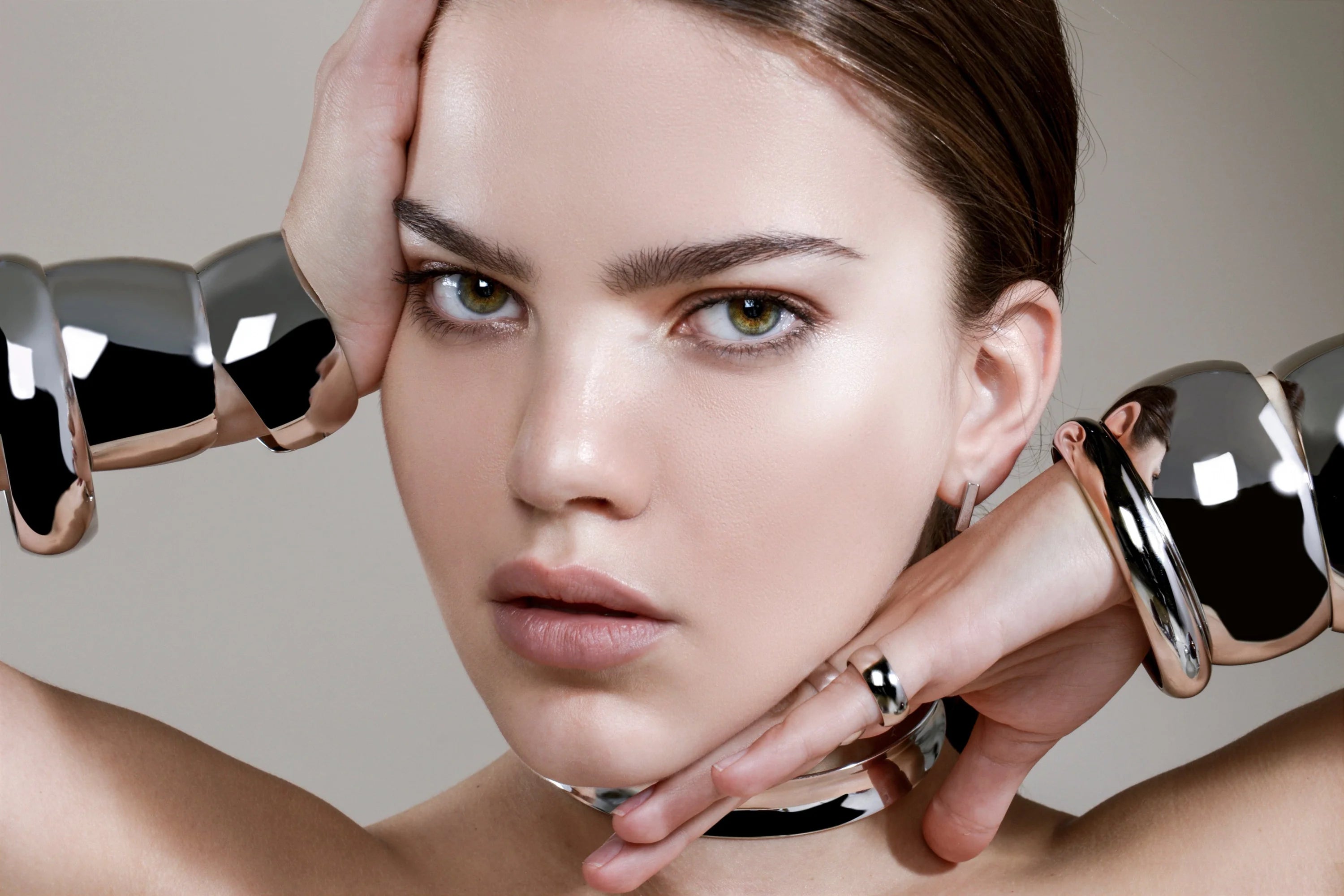 Woman wearing stylish silver jewelry showcasing the Large Domed Bangle