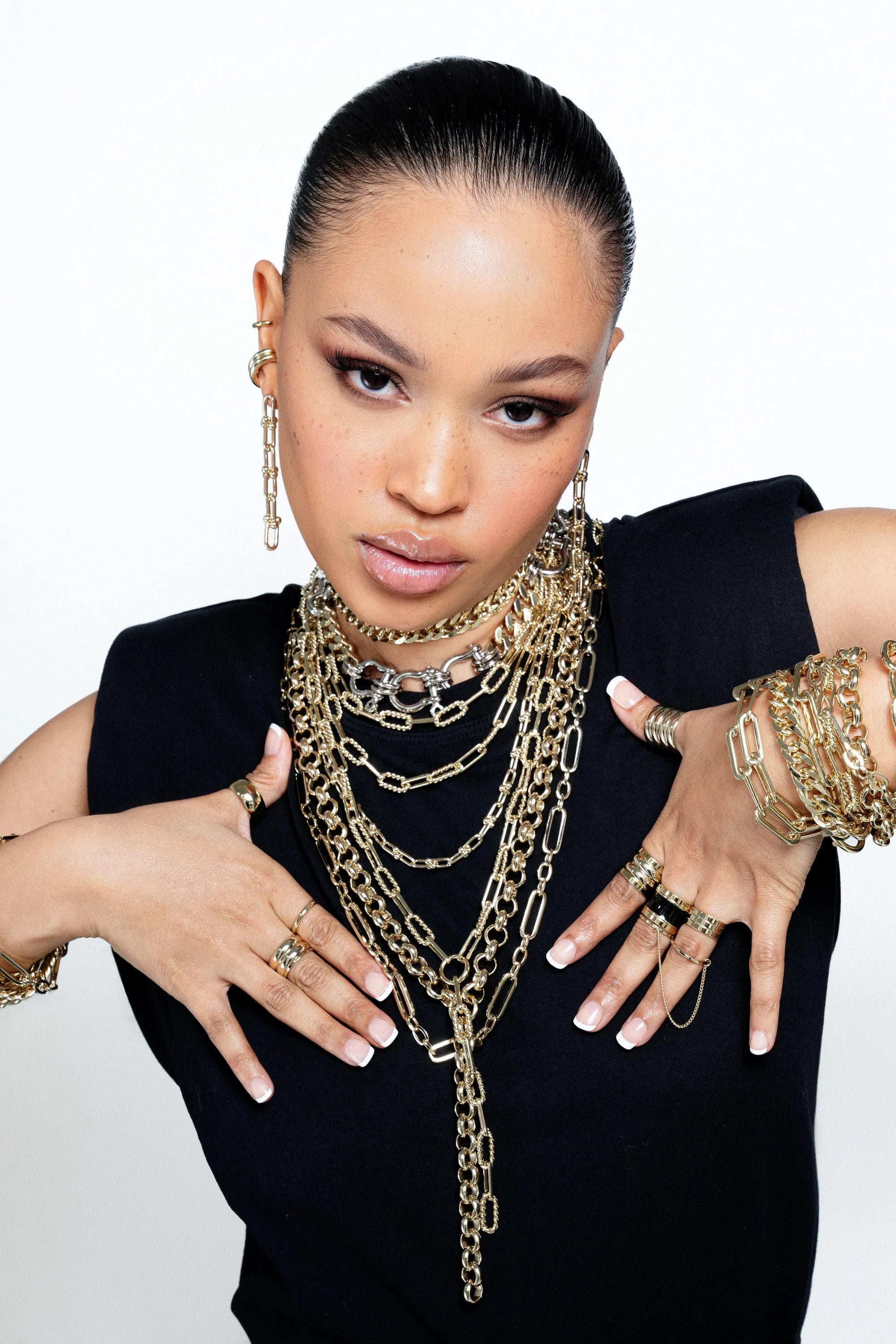 Woman wearing stunning Margaux 6 Link Drop Earrings with gold jewelry style