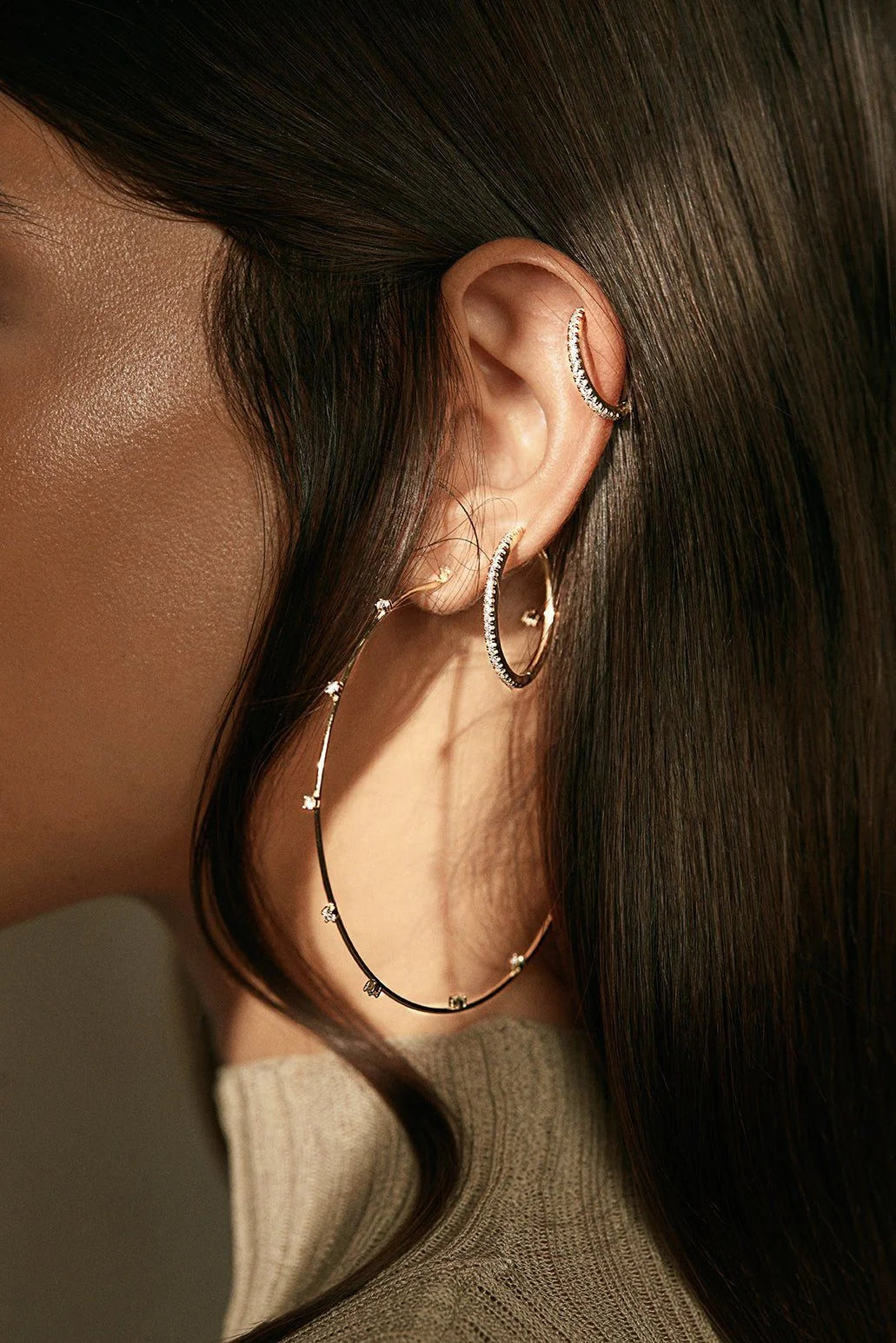 Medium CZ Huggie Hoop Earrings worn in ear with hoop and cuff jewelry style