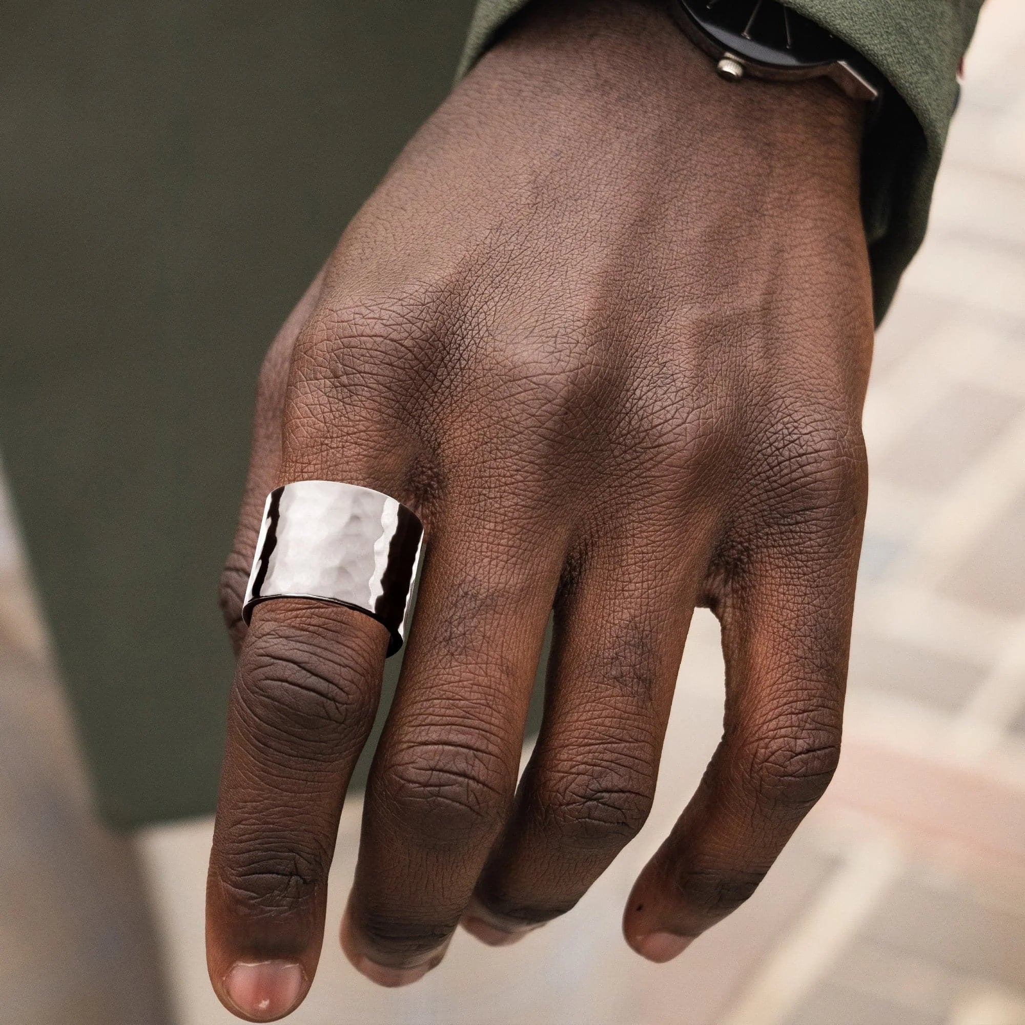 Hammered silver men’s wide ring for a cool, rugged look