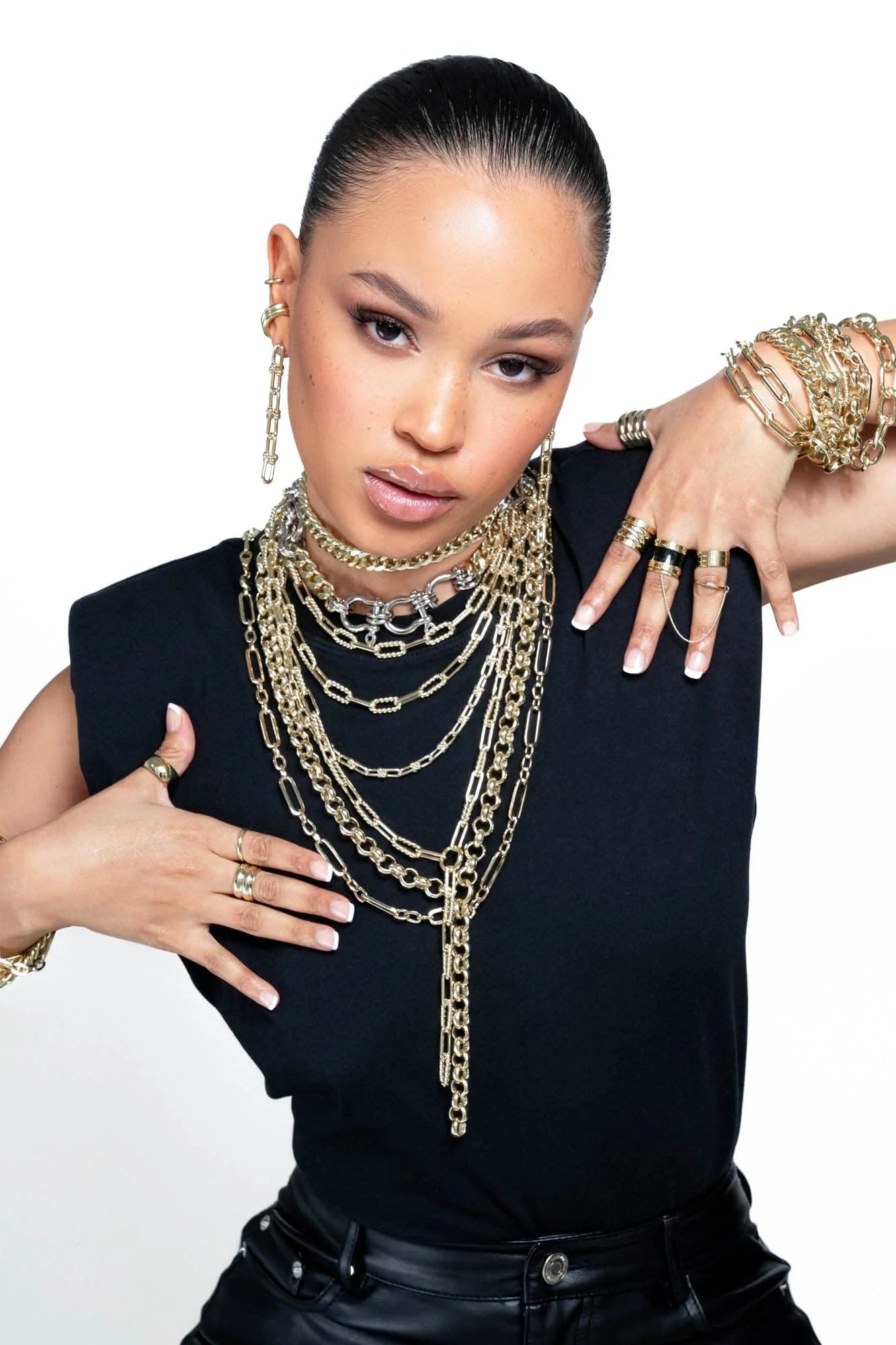 Woman wearing the stunning Dean Necklace with beautiful gold jewelry