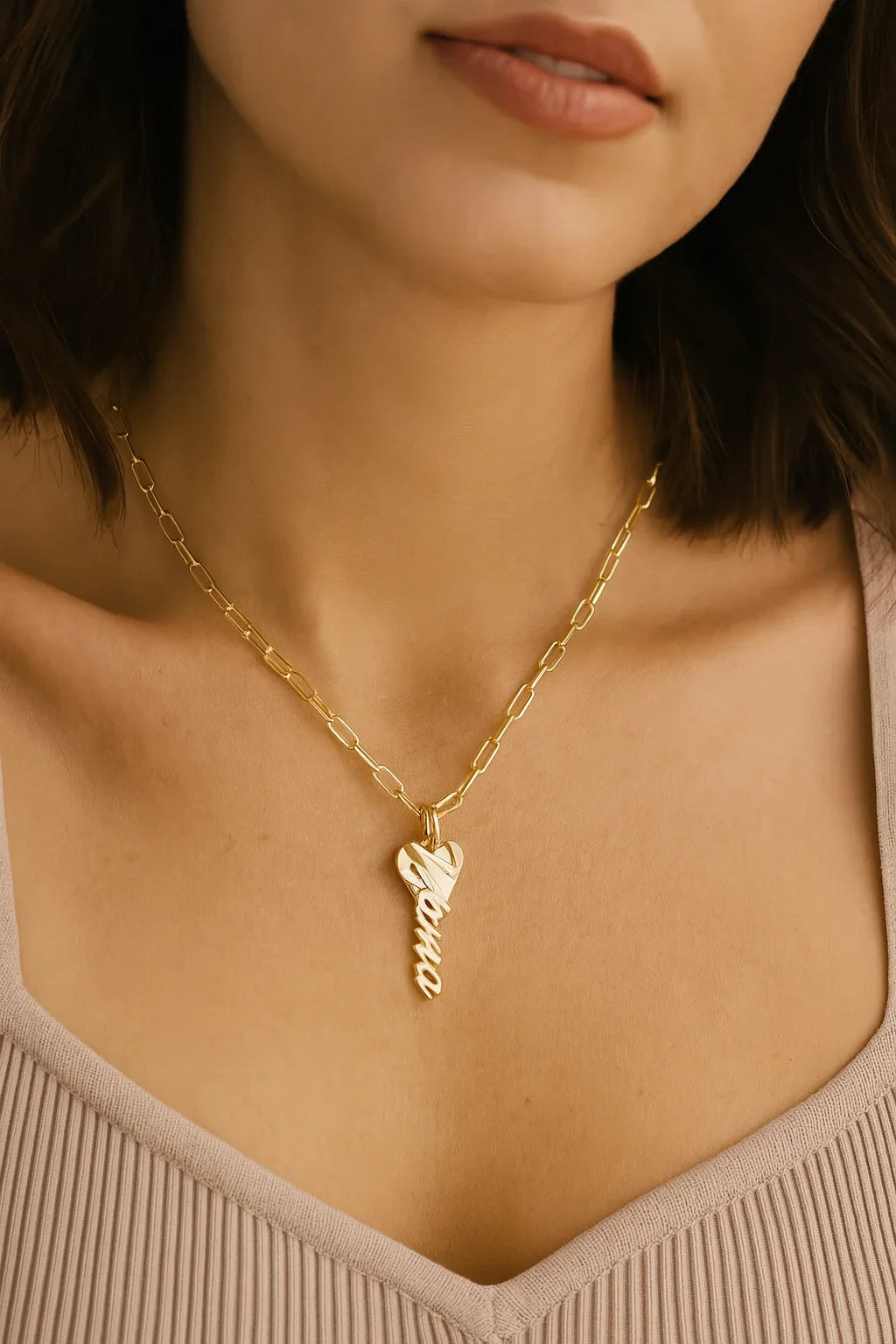 Gold-tone paperclip chain necklace with a heart-shaped key pendant from Mara Charm Necklace