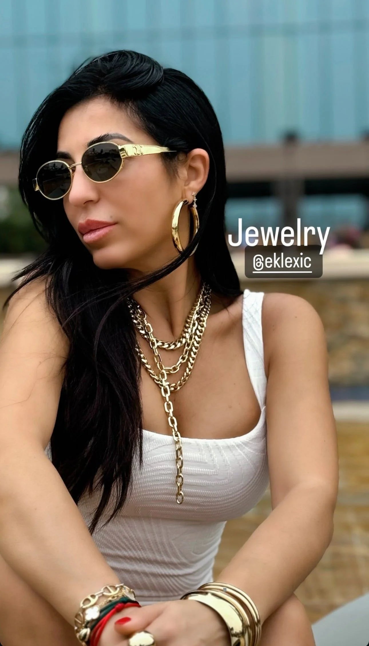 Woman wearing the elegant Serenity Necklace with stunning gold jewelry for a chic look