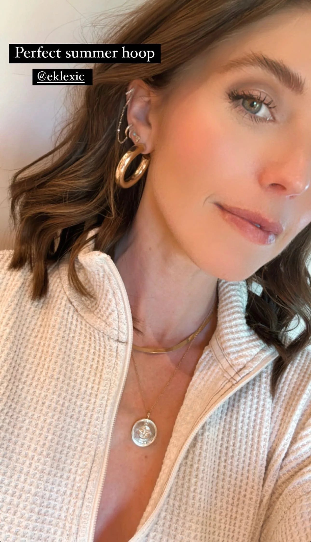 Woman wearing Zolen Hoops gold jewelry showing elegant style