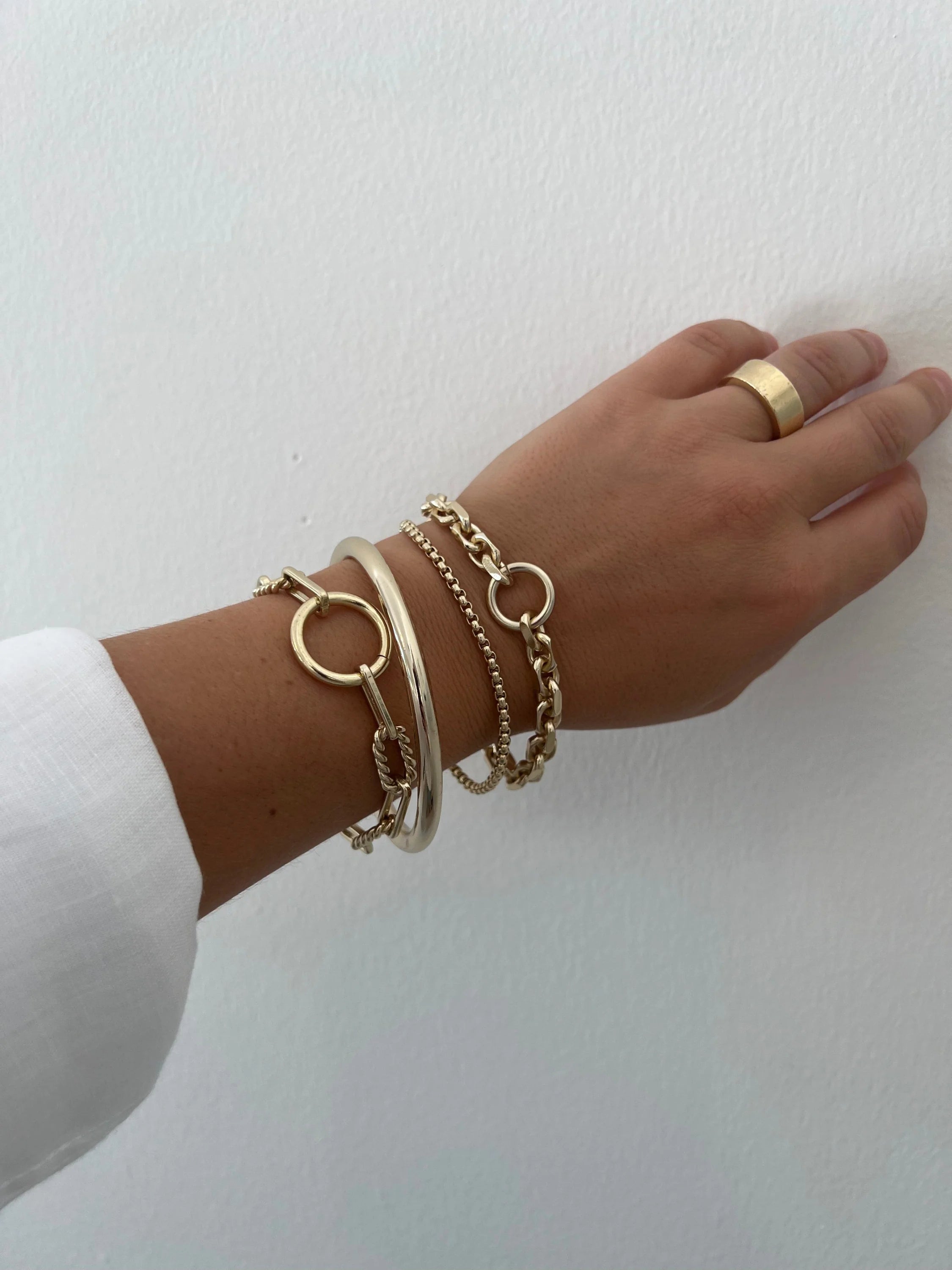 Gold-toned bracelets and ring from the Eliza Bracelet collection good for stacking style