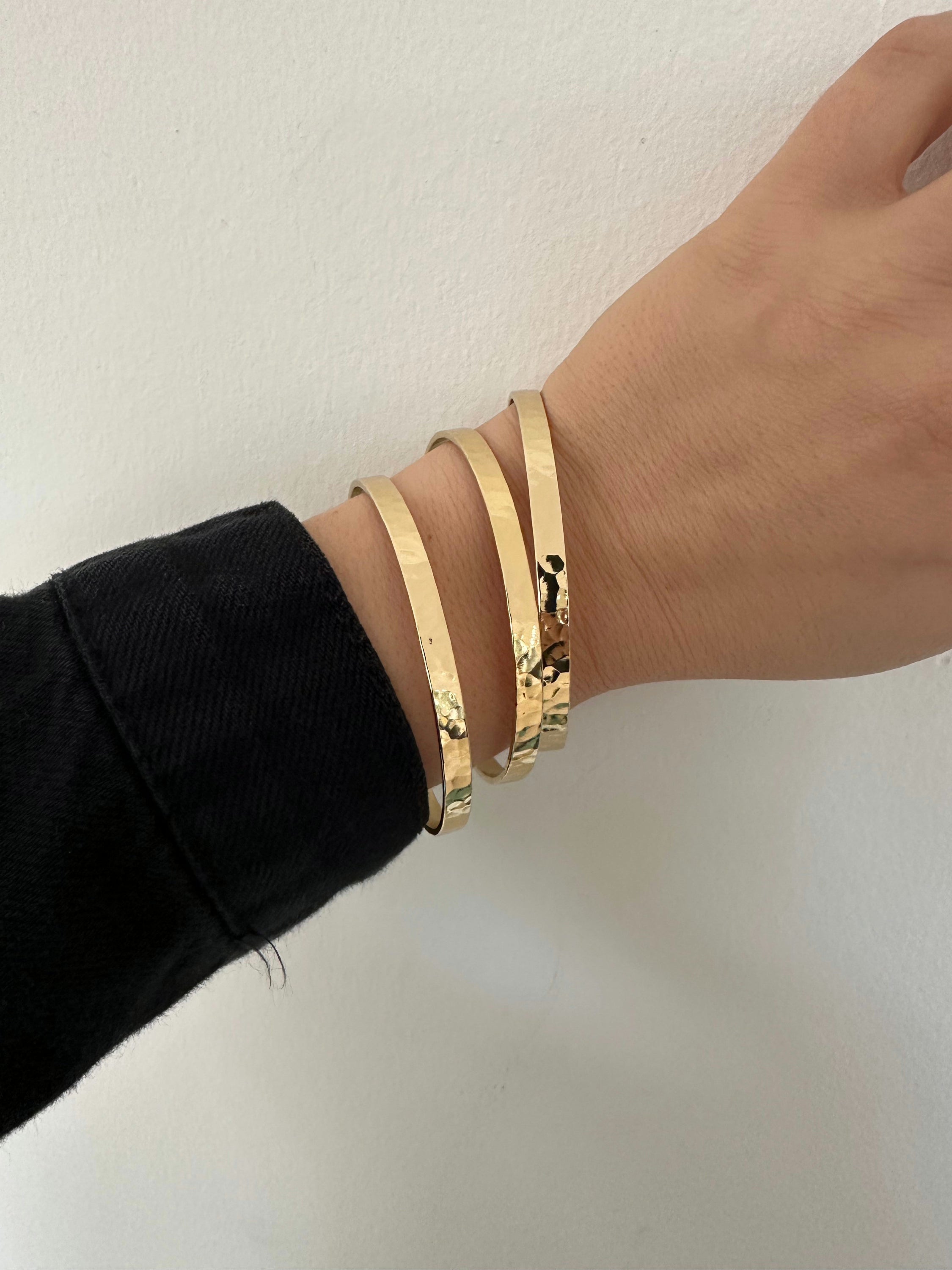 Elegant 8mm wide brass hammered bangles displayed in the Hammered Bangle product image