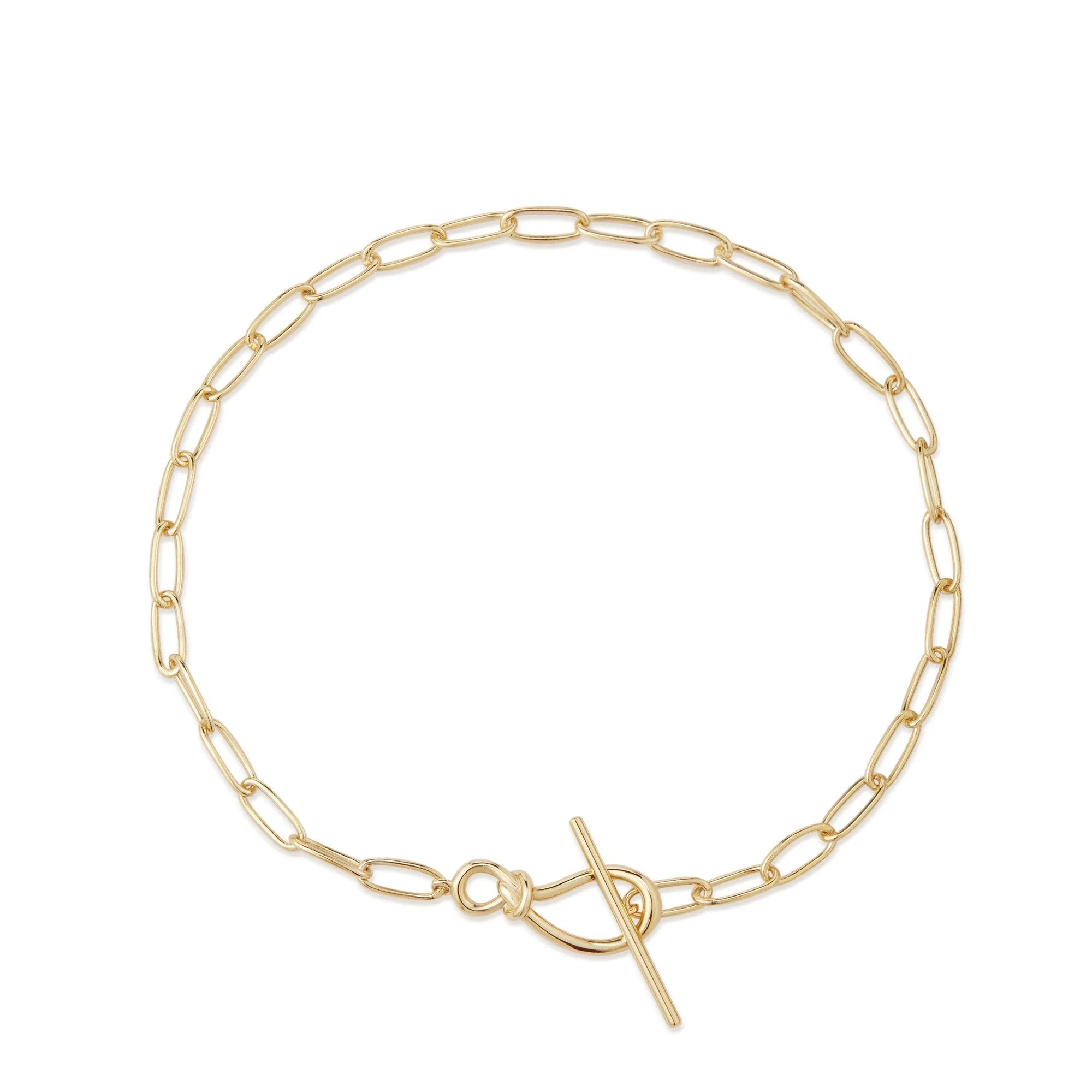 Sterling silver paperclip chain bracelet with knot toggle clasp on jewelry display