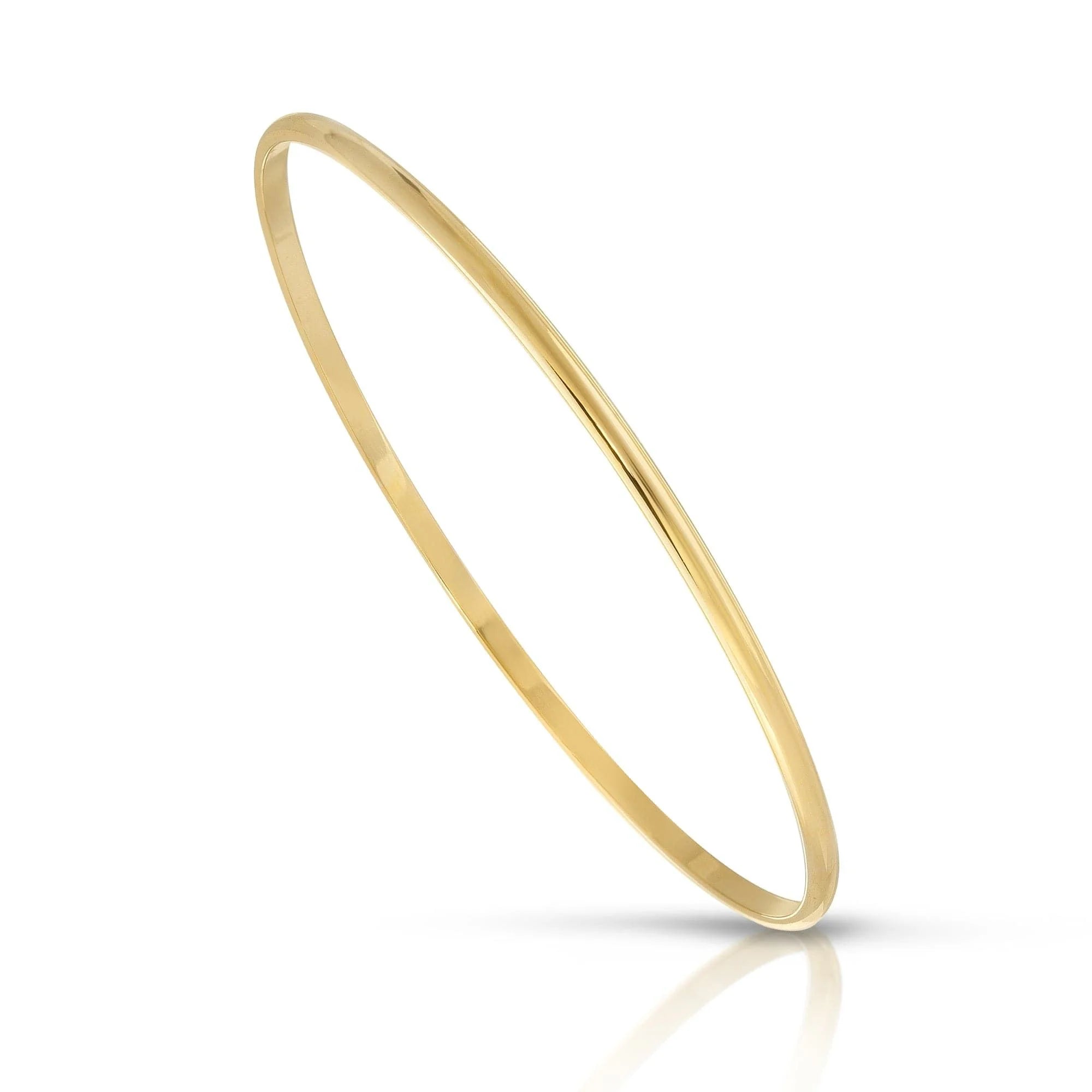 Thin gold bangle from Skinny Lucy Recycled collection made of Lucy recycled brass
