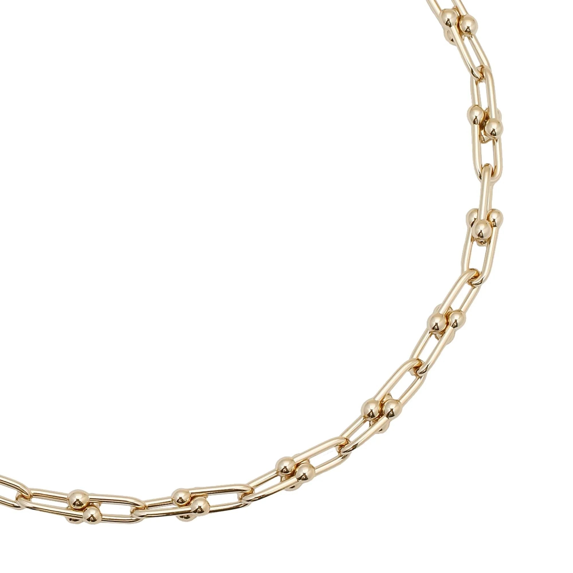 Small Margaux Necklace featuring a 14k gold chain with spherical accents and custom U link