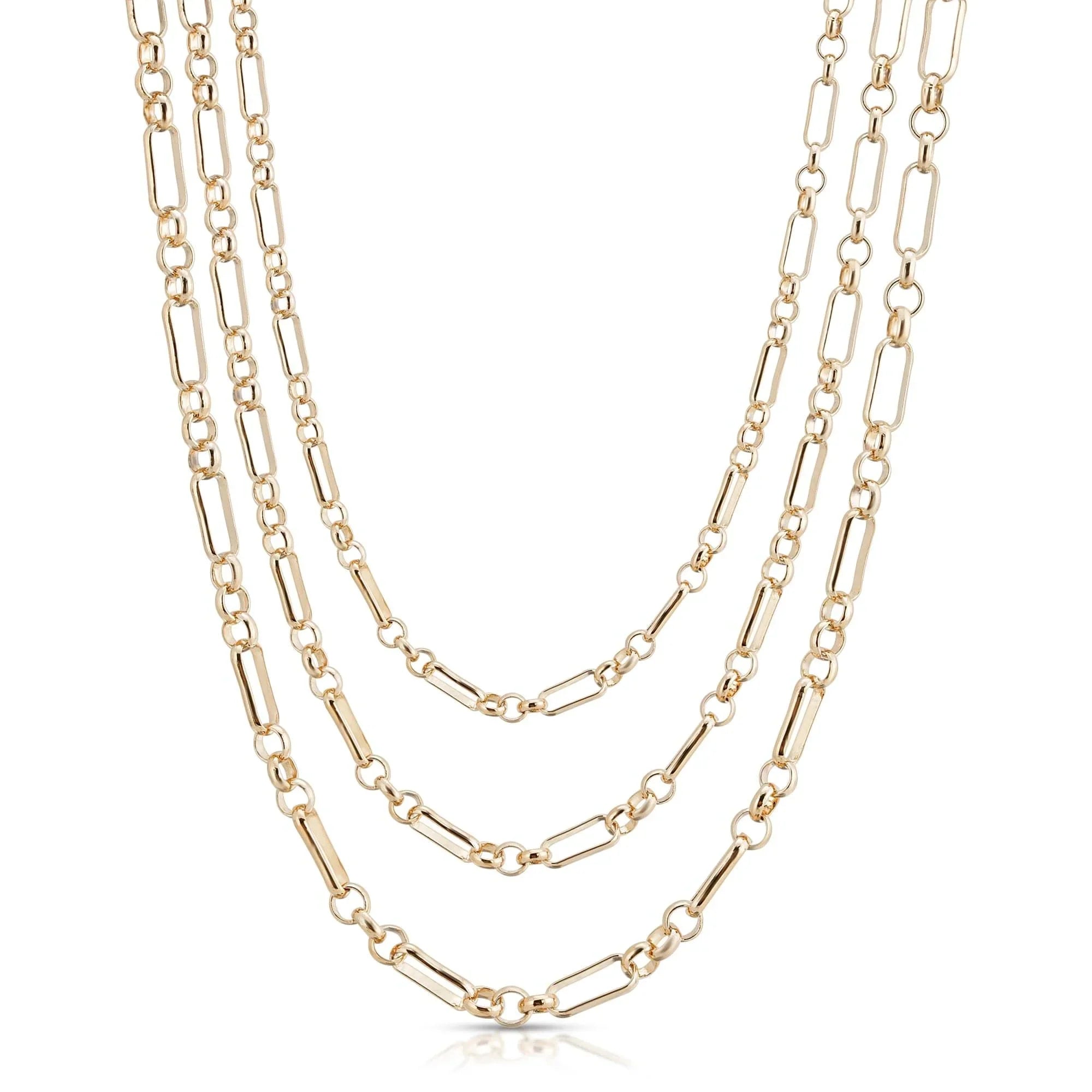 Triple small multi link gold chain necklace lying flat for a stylish look