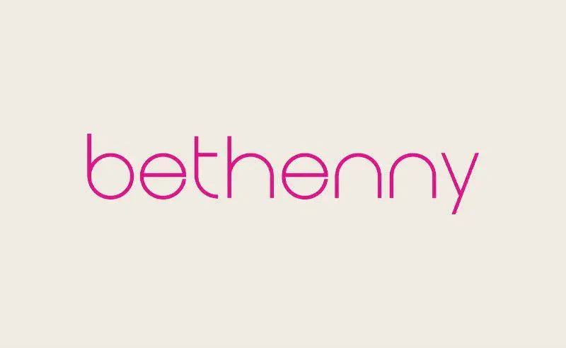 Bethenny logo in pink displayed in article about Keshia Chante wearing EKLEXIC Bullet Collection Necklace
