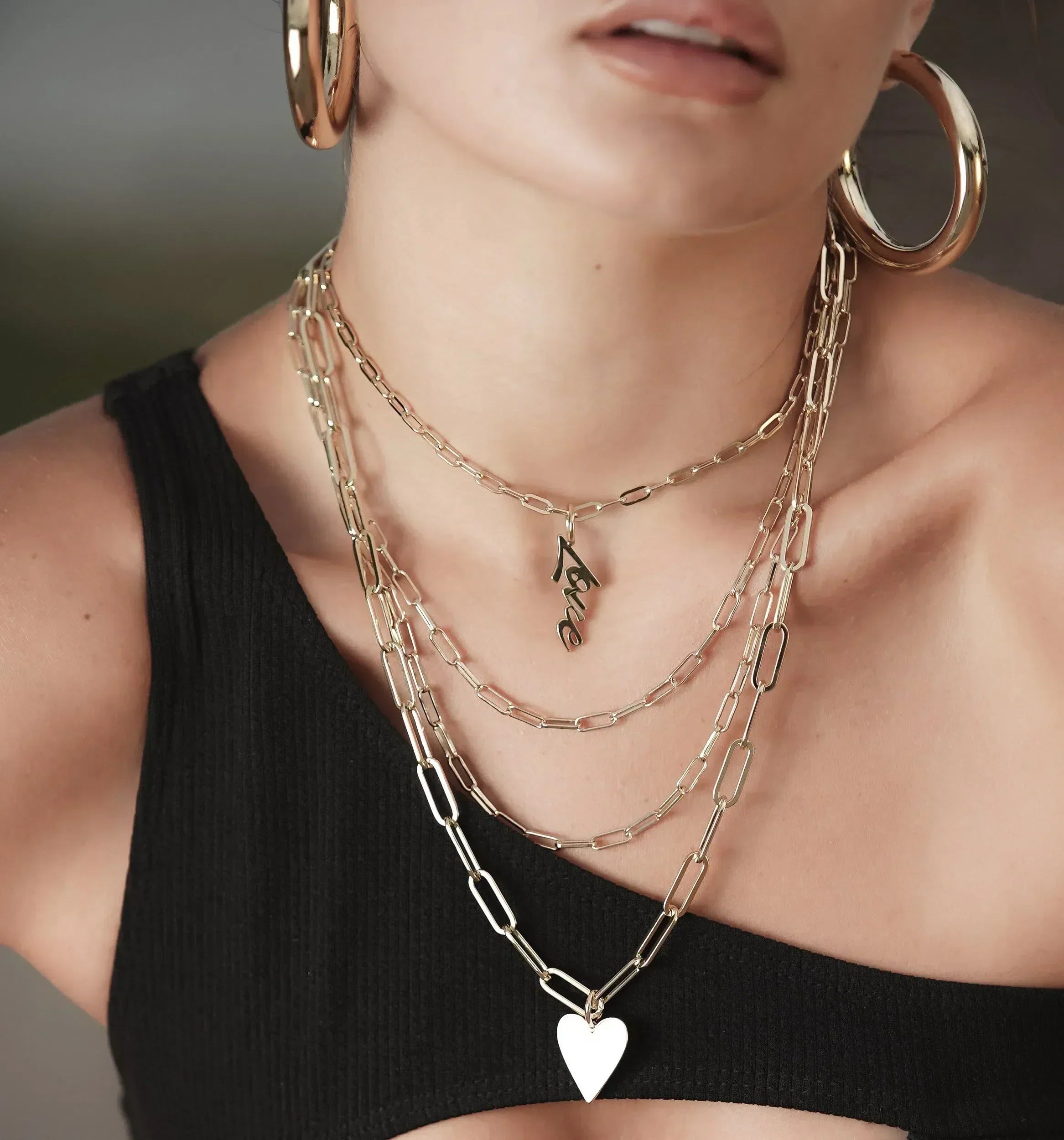 Gold layered necklaces with pendants showcased in Trending Layered Necklace Set Options article