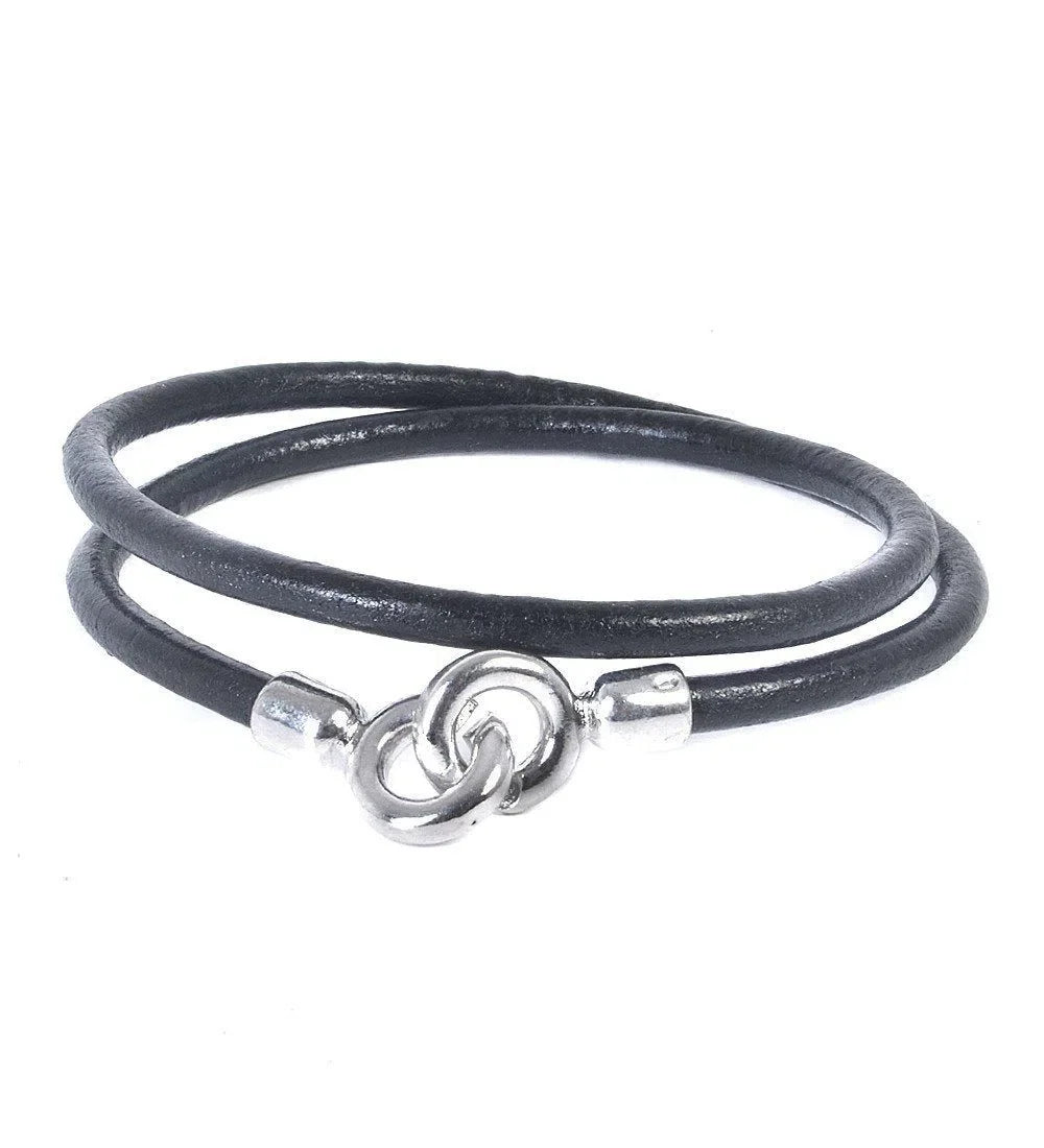 Black leather wrap bracelet with silver clasp showcasing Eklexic’s men’s fashion style.