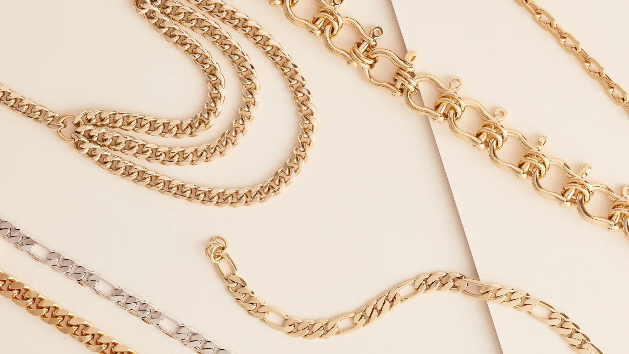 Assorted gold chains displayed in a collection of elegant link designs.