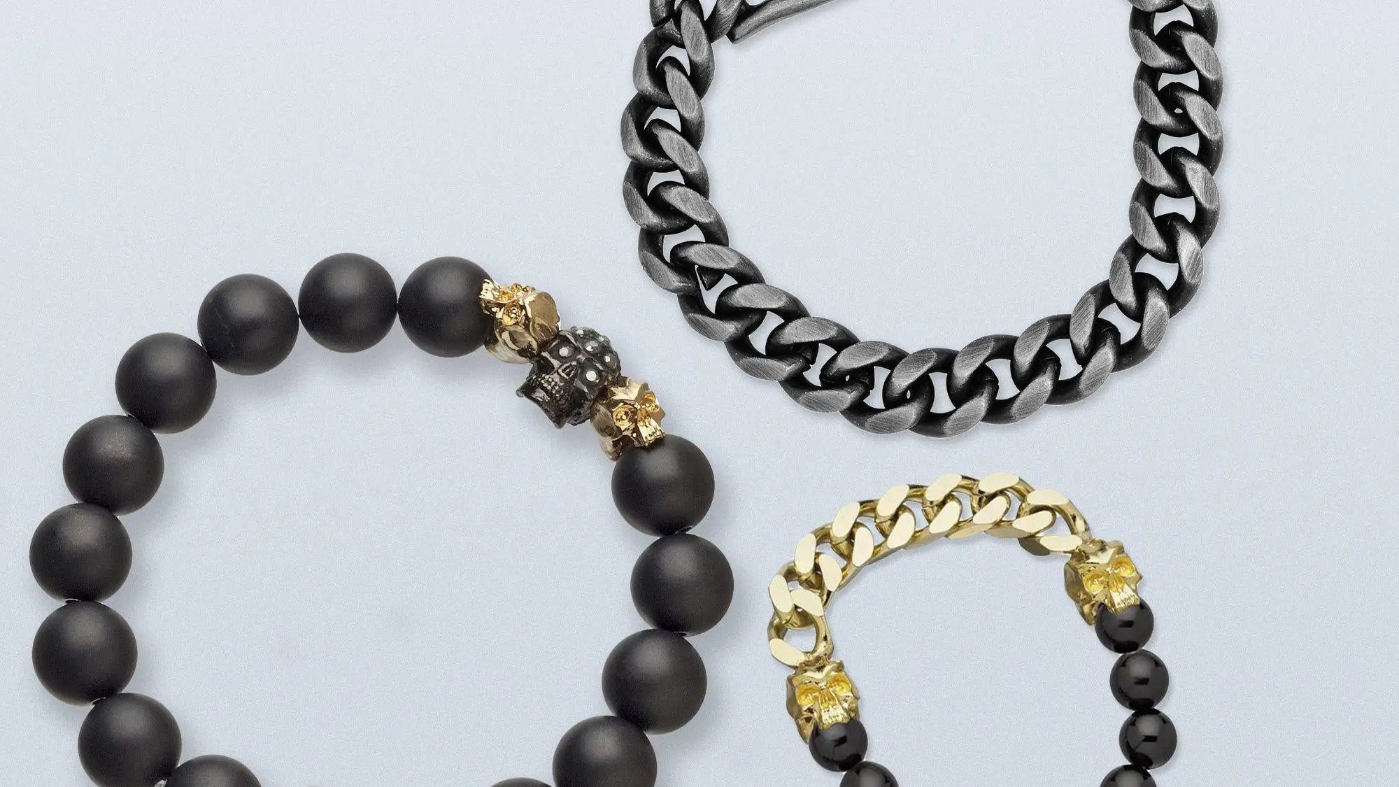 Assorted men’s bracelets including gold, silver, and chain bracelet styles.