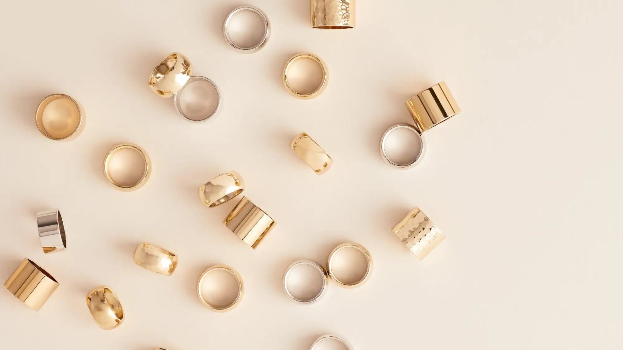 Scattered 14k gold vermeil and plated sterling silver rings in a stylish collection.