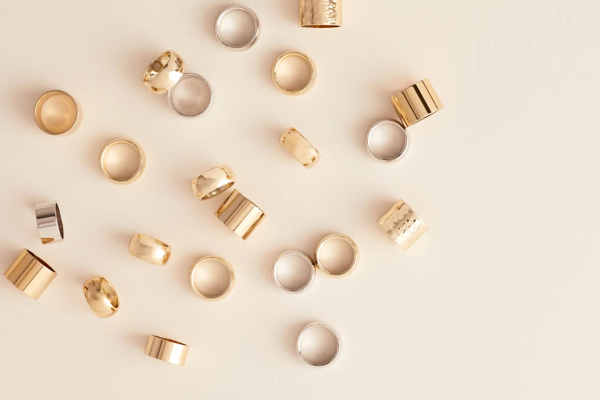 Scattered gold and silver rings including 14k gold and plated sterling silver designs