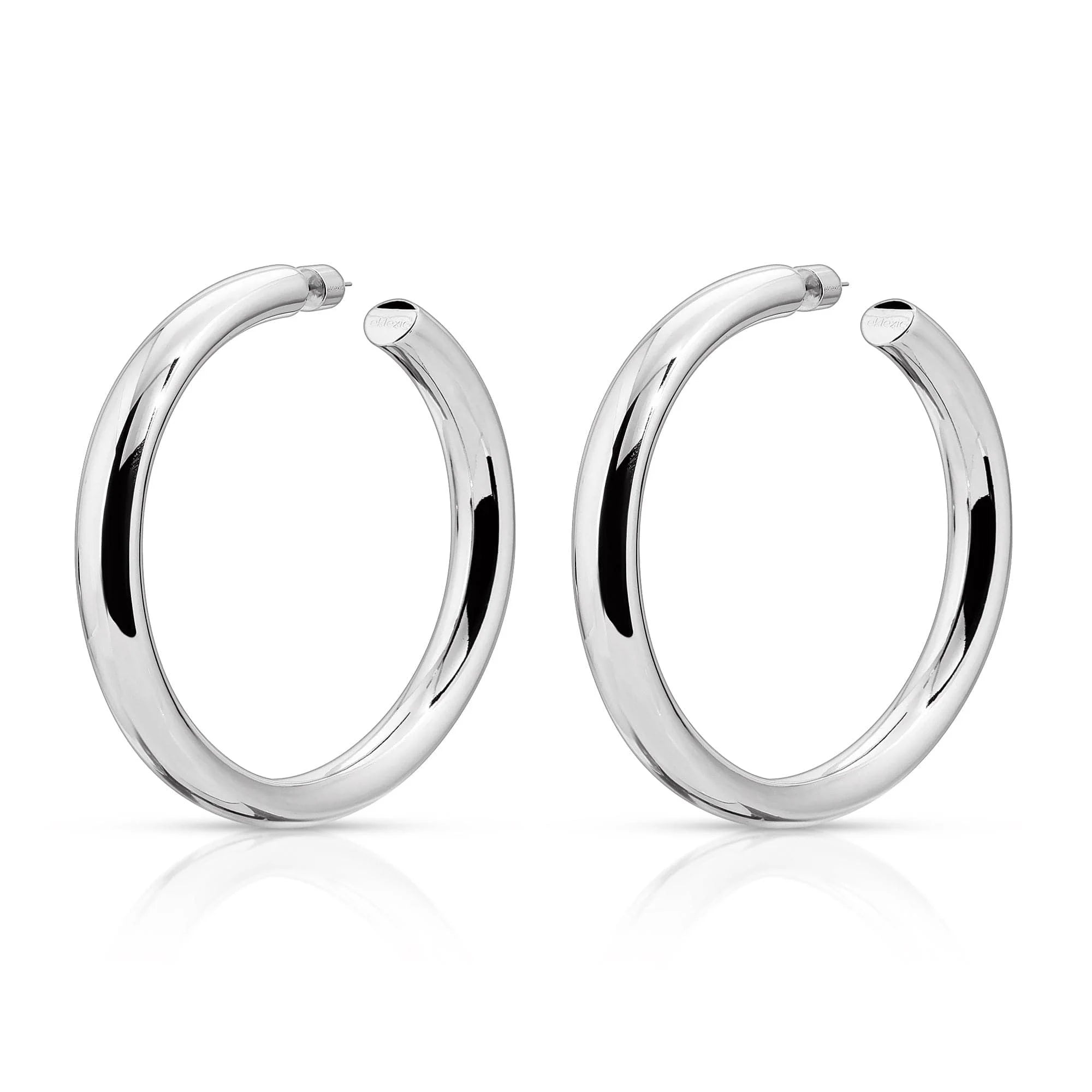 Pair of silver Kelly Hoops earrings highlighting 1.5-inch hoop design *editors note