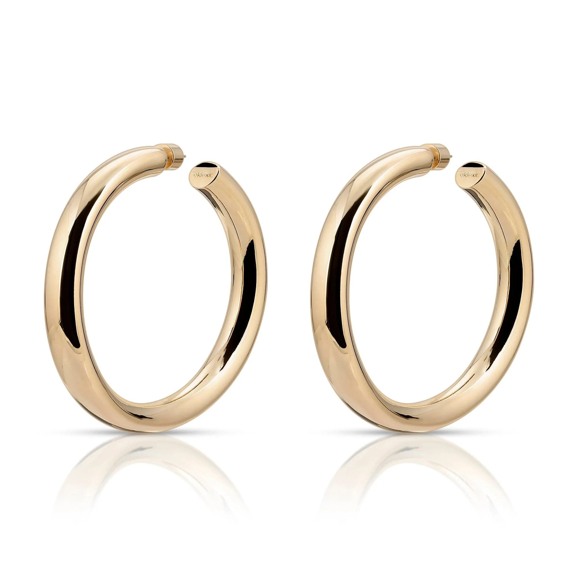 Pair of gold hoop earrings from 1.5 inch Ryan Hoops collection Editors Note