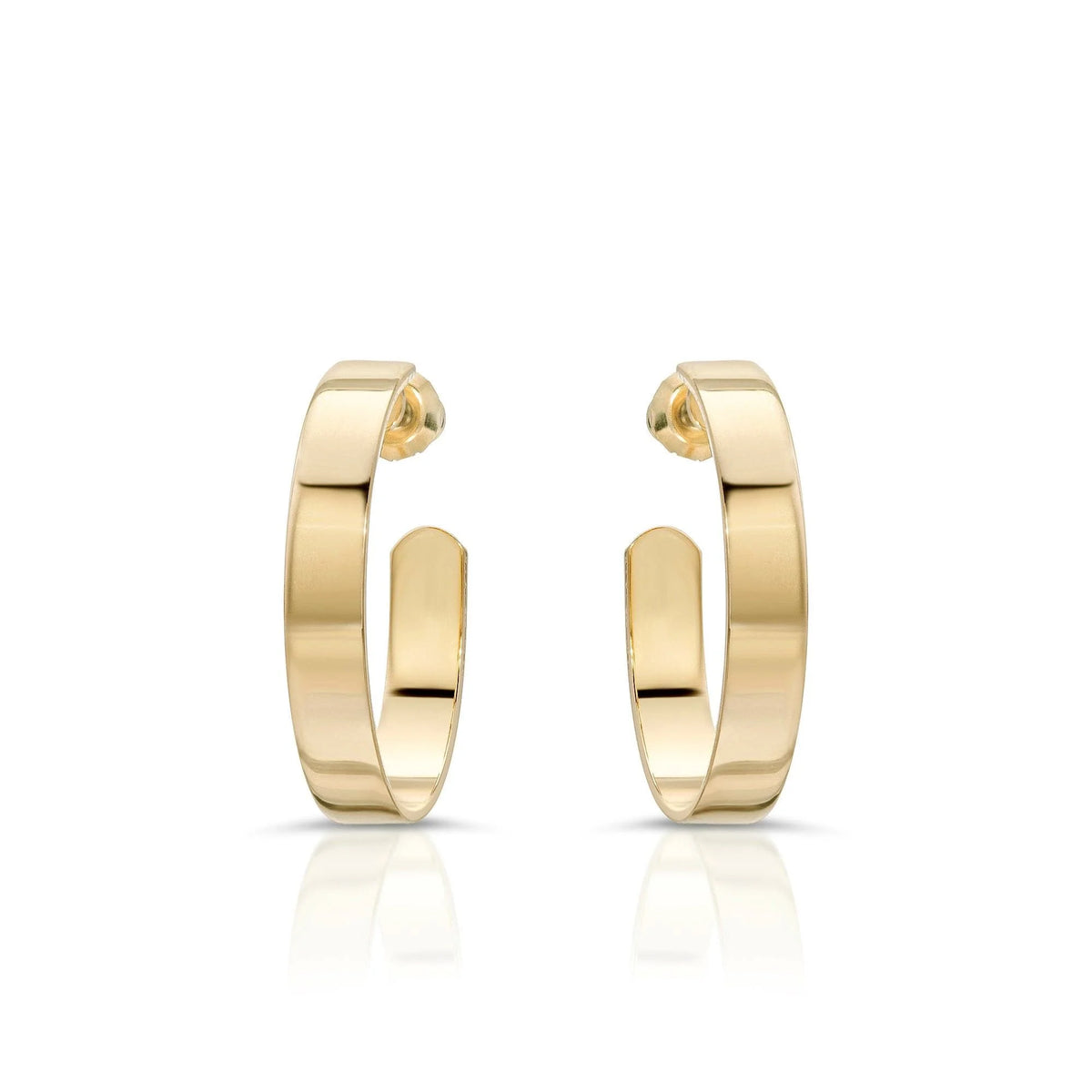 Shiny gold 1 inch Isla Hoops earrings showing off a cute and trendy style