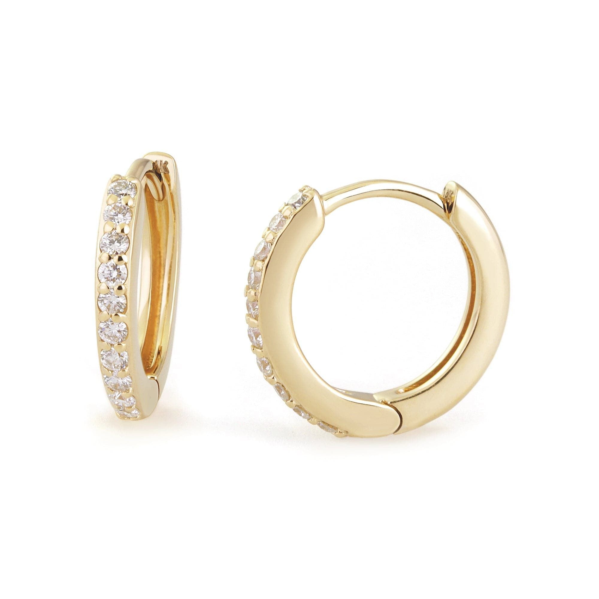 Gold hoop earrings with embedded crystals in 14K Gold Huggies, showcasing 10mm diamonds