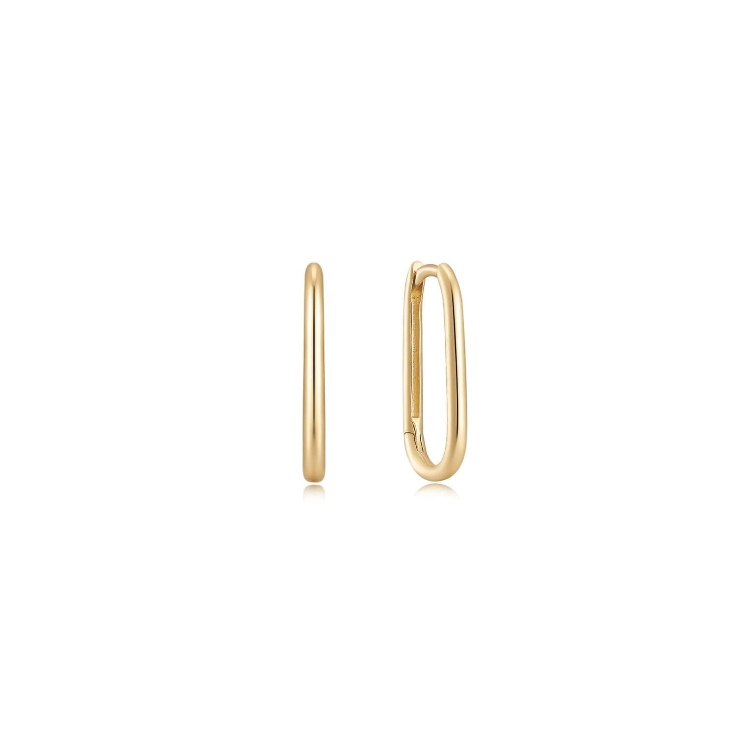 14K Gold Essential Oval Huggie Hoops in solid yellow gold, featuring elegant oval shape