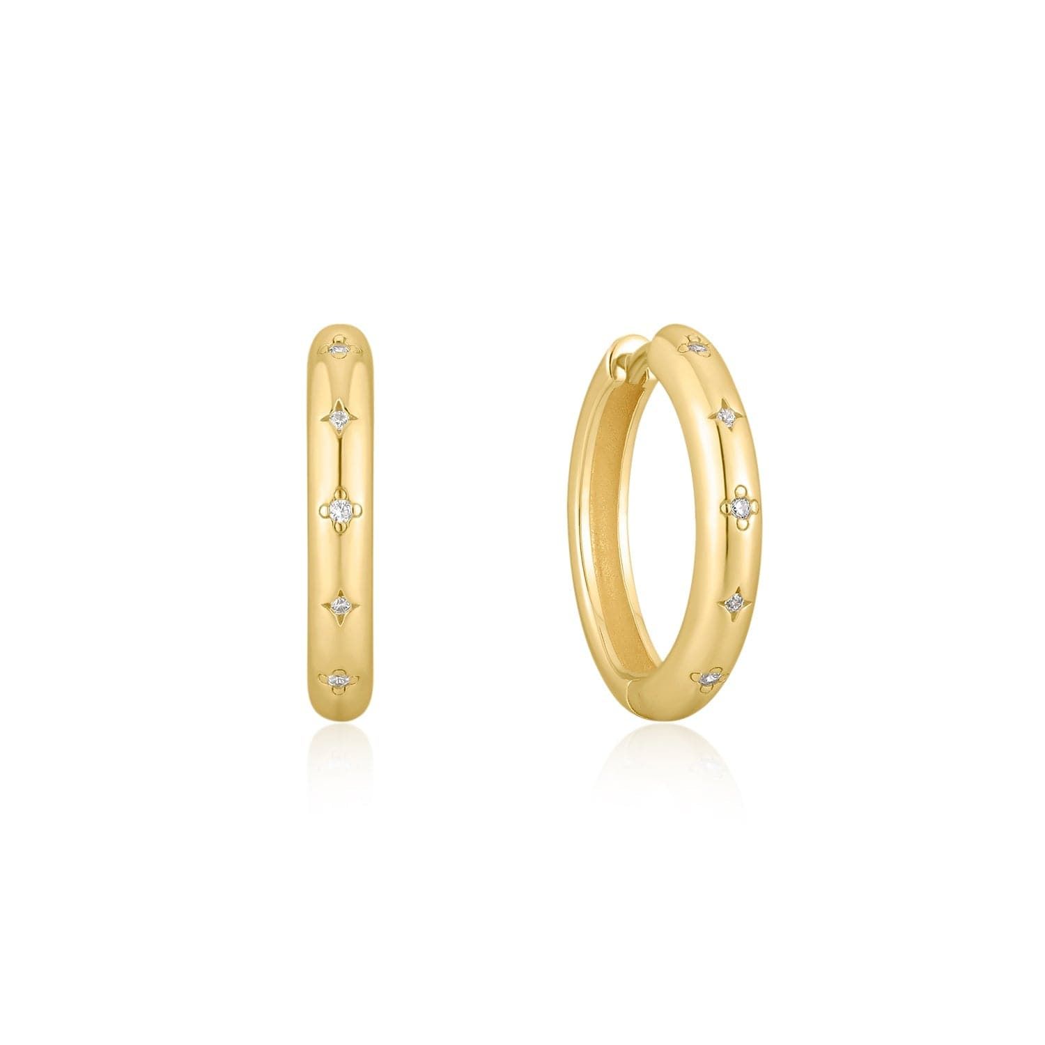 a pair of gold hoop earrings with diamonds