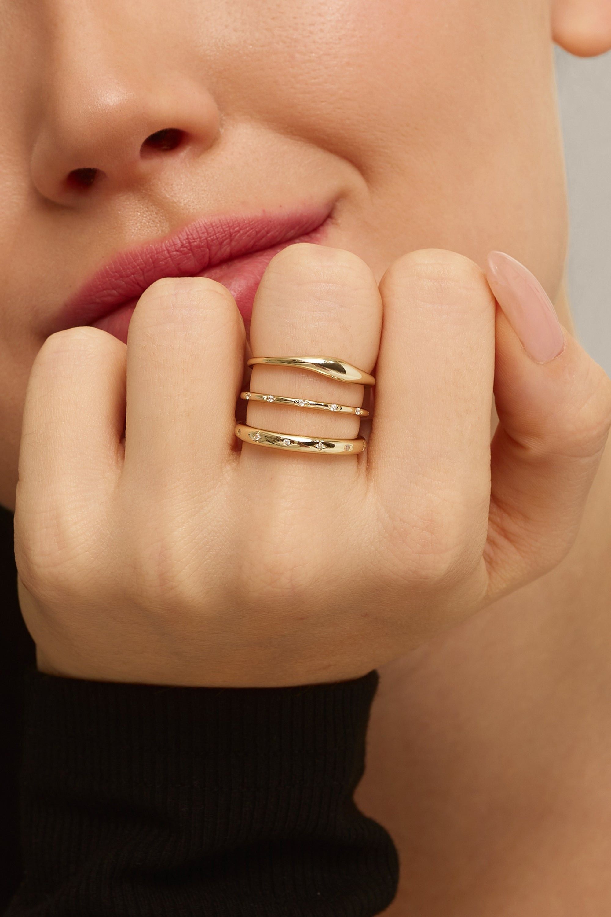 Gold-toned triple ring set featuring 2.8mm CZ stones in 14k gold vermeil design